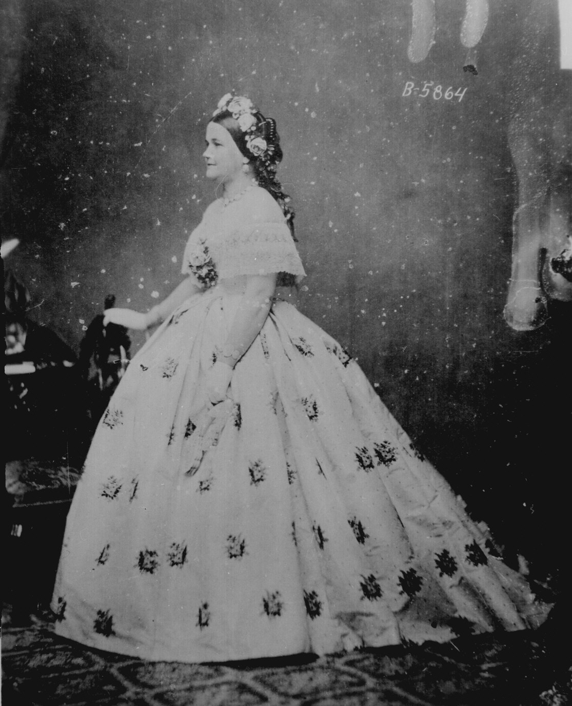 Mary Lincoln, with flowers in her hair and looking pretty AMAZING. Elizabeth Keckley would have helped pick out the fabrics and done some of this sewing work by hand. Courtesy of the National Archives.