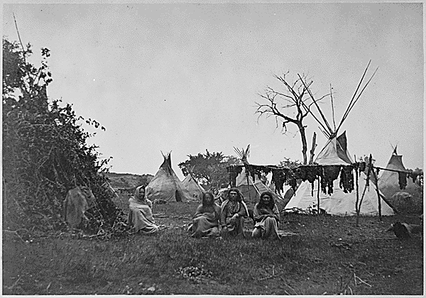 Tepees in an Arapaho camp, with buffalo meat drying, near Fort Dodge, Kansas. Courtesy of the National Archives and Records Administration.