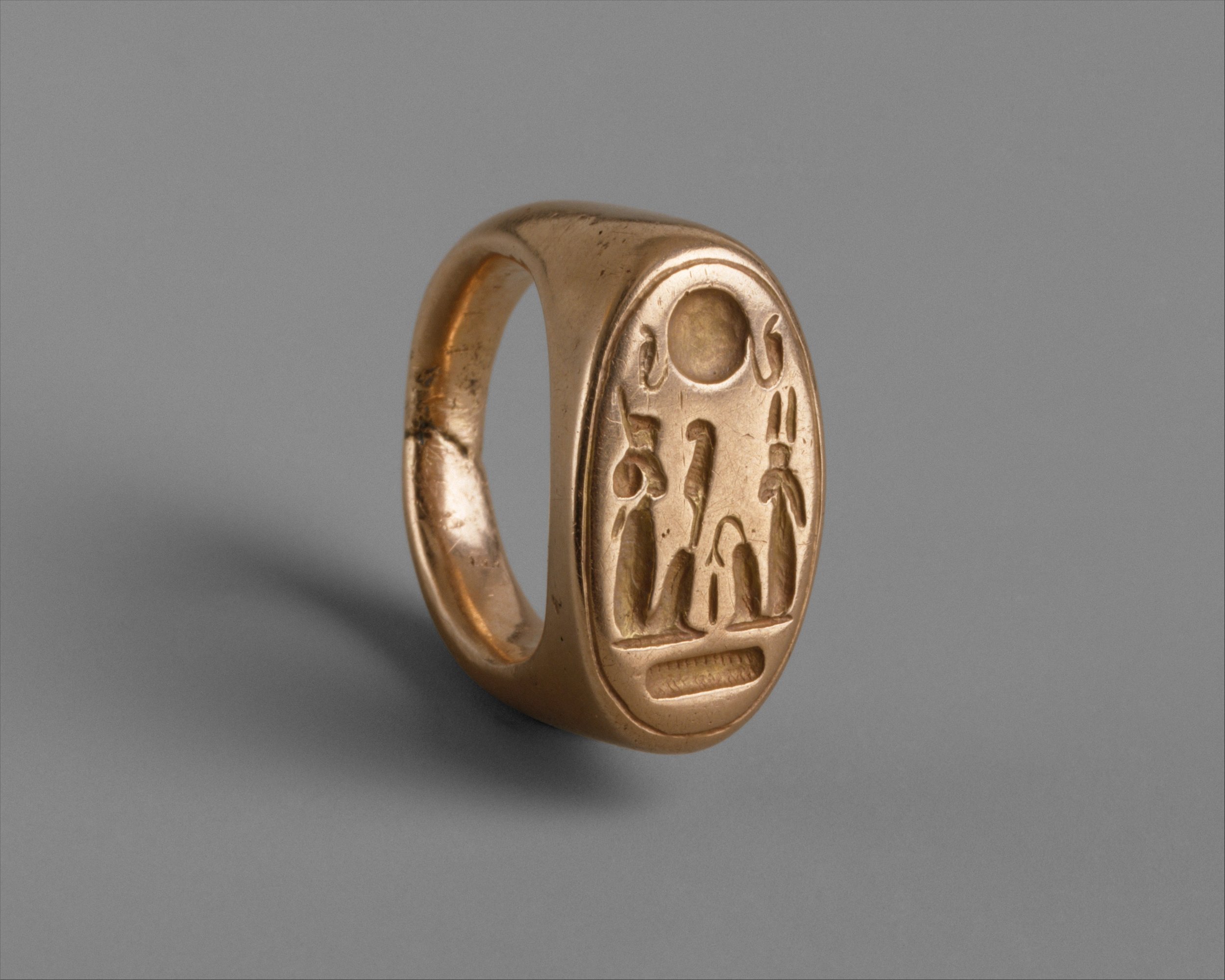 A fancy finger ring depicting Akhenaten and Queen Nefertiti as Shu and Tefnut. Divine as all get out.