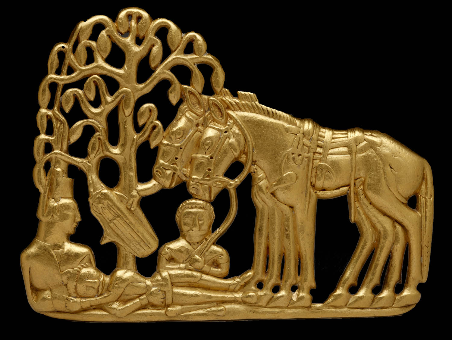 In this gold belt plaque, we see Scythians with horses under a tree. Shiny! 