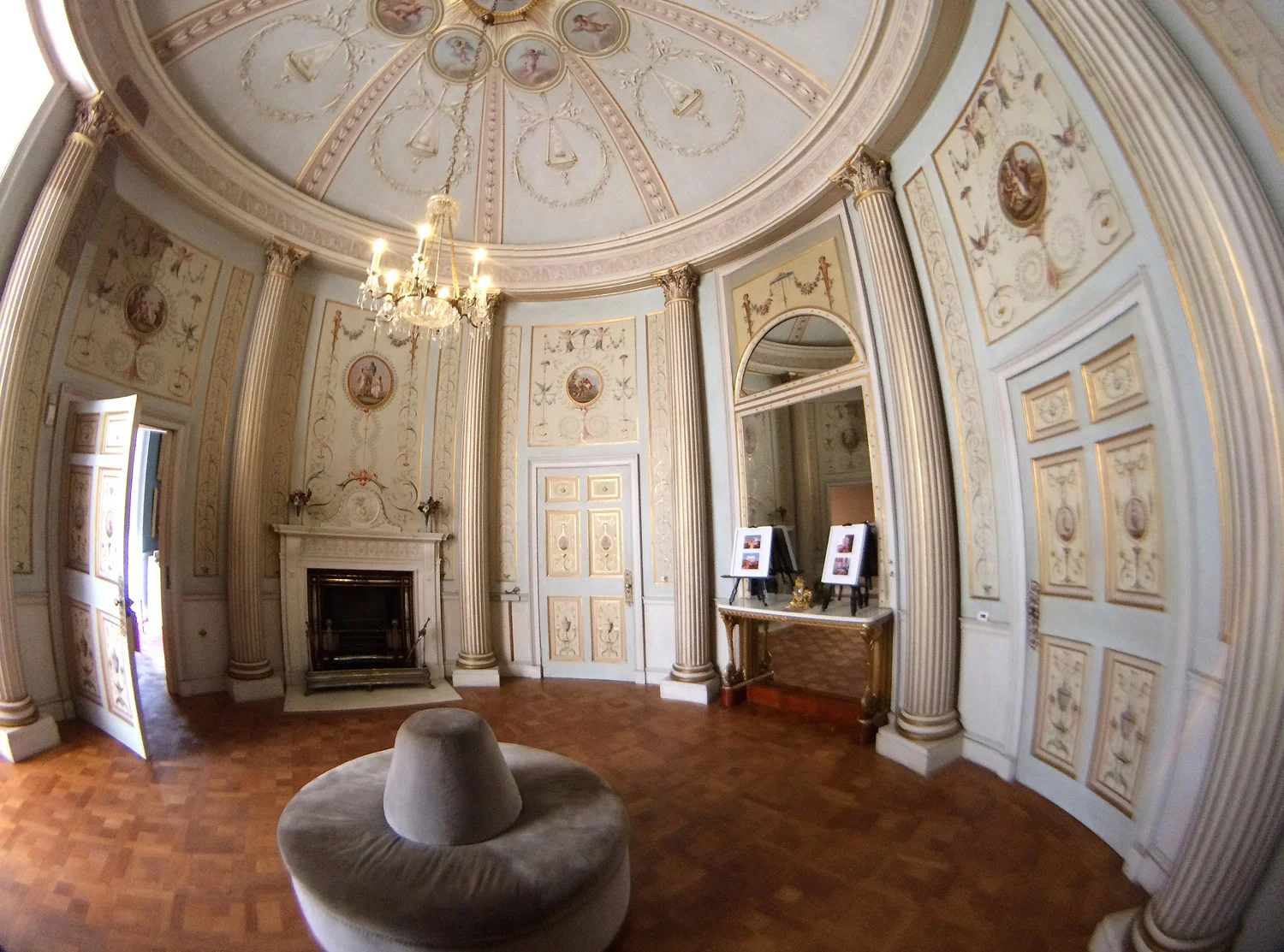 Fisheye lens attached, distorting the vertical columns in an already round shaped room