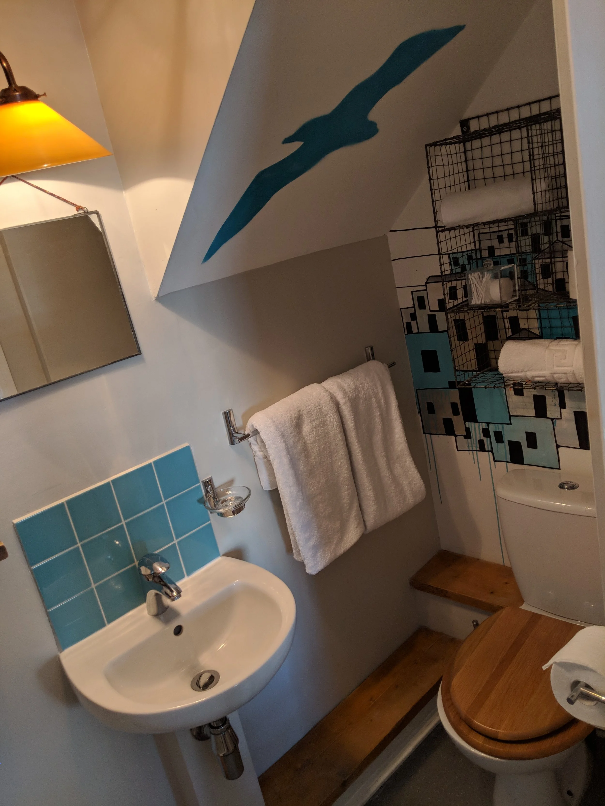 The excellent artwork continues into the smallest room too