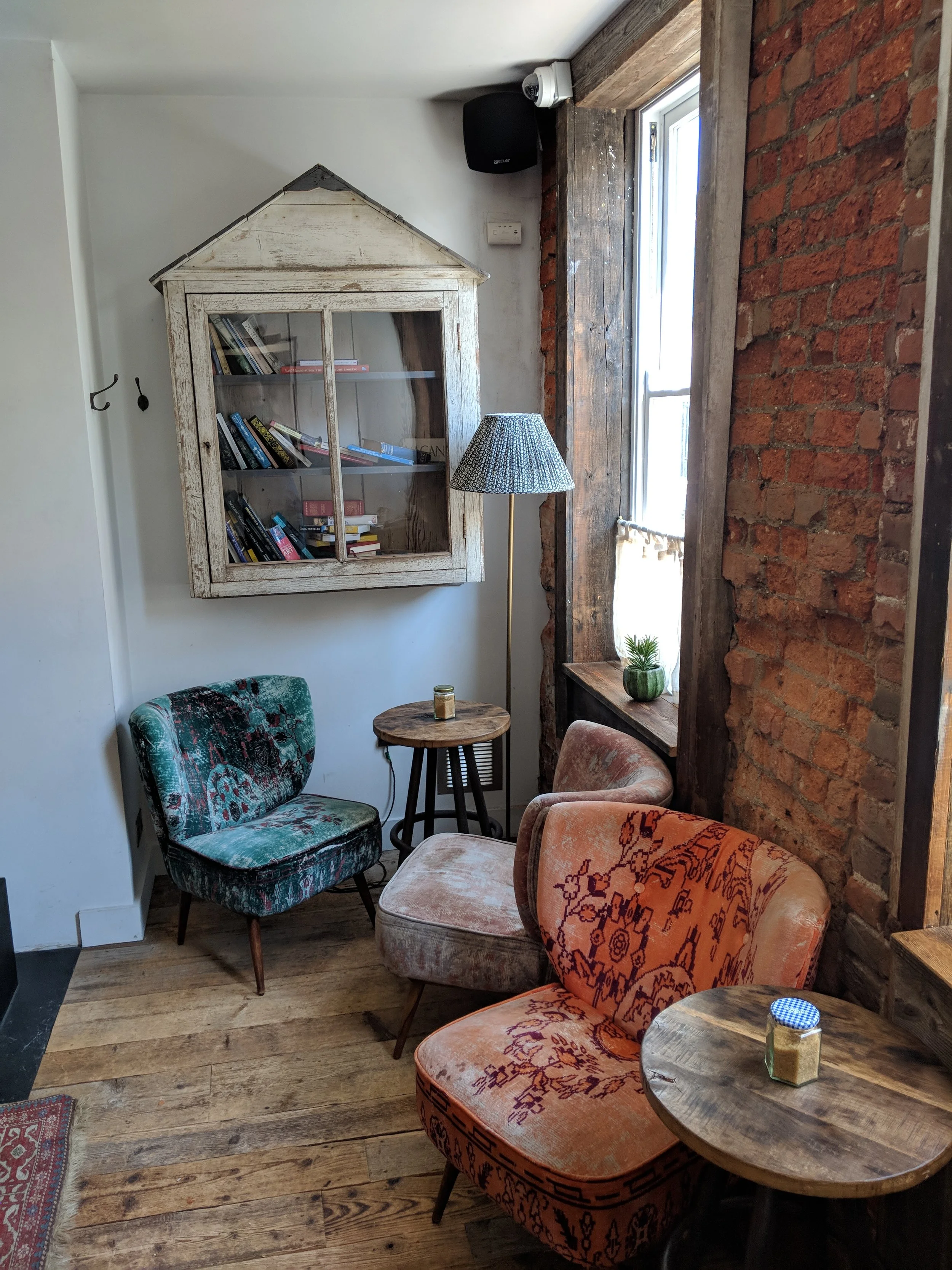 The lounge downstairs in The Artist Residence is a great place to sit, take advantage of £4 happy hour cocktails and read the many books that dot the shelves