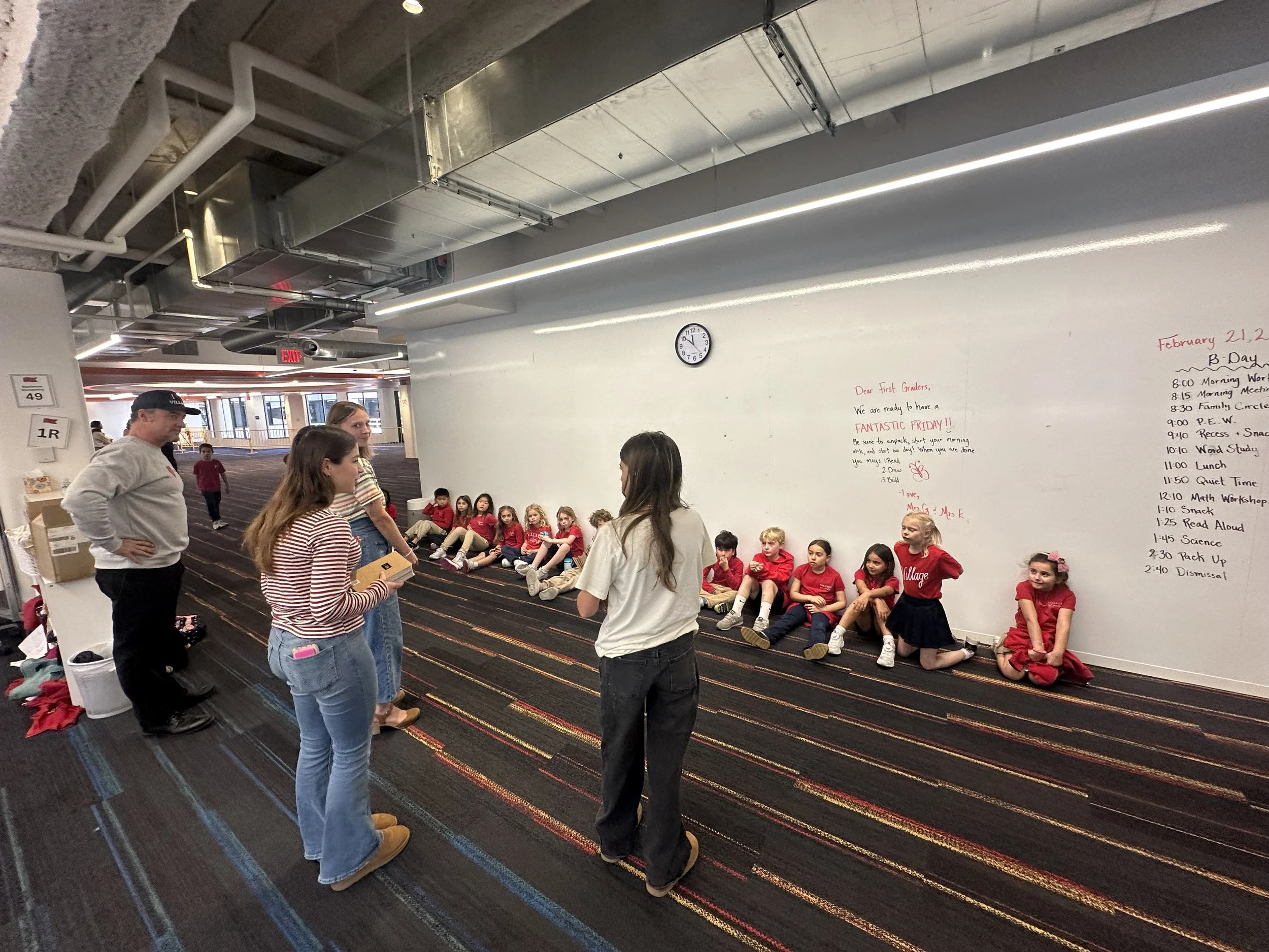 Telling Story to kids against wall.jpg