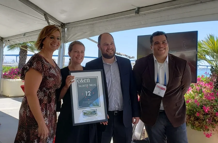 Cora receives the award from sponsors