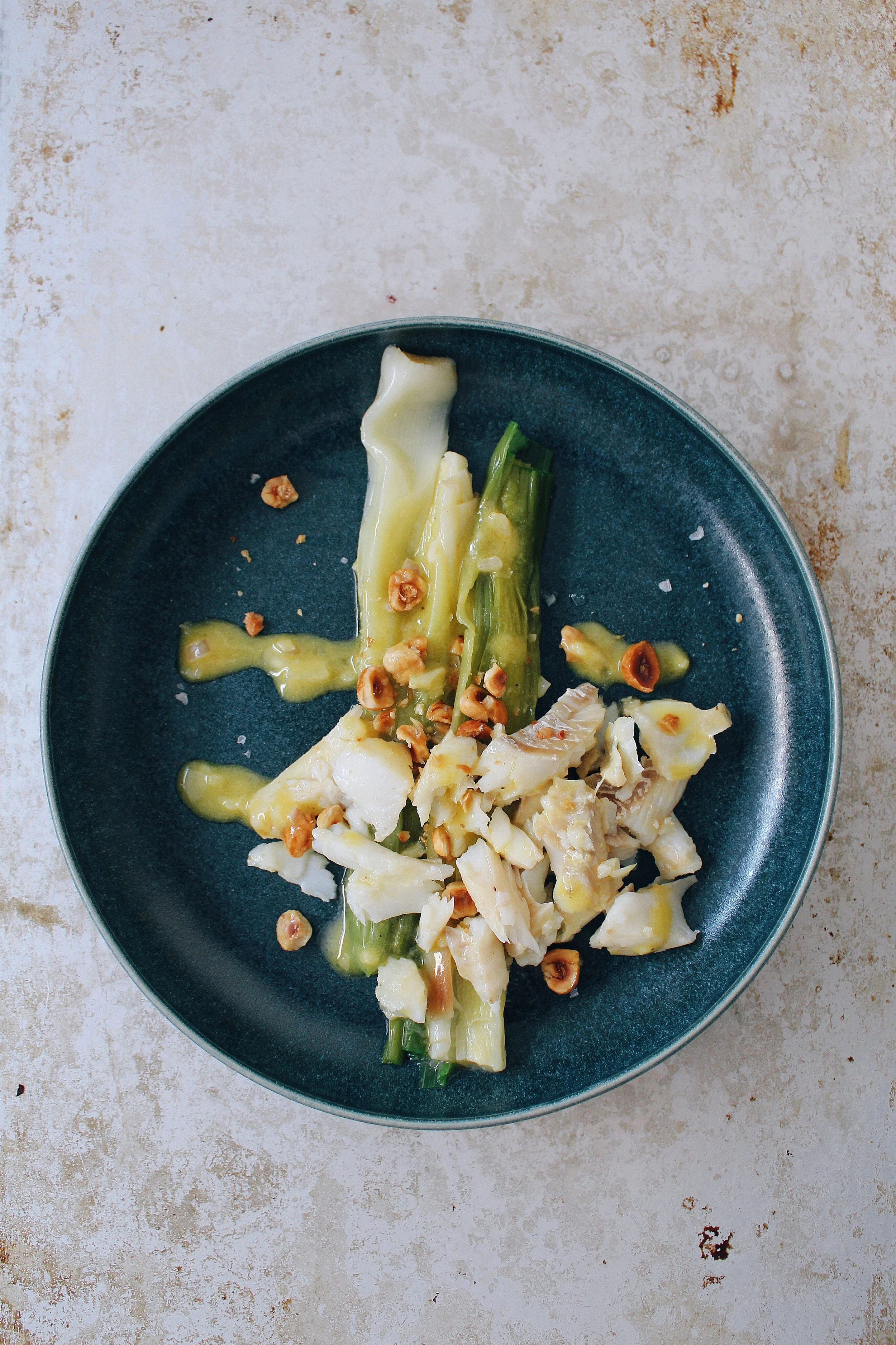 Leeks vinaigrette, cod and hazelnuts