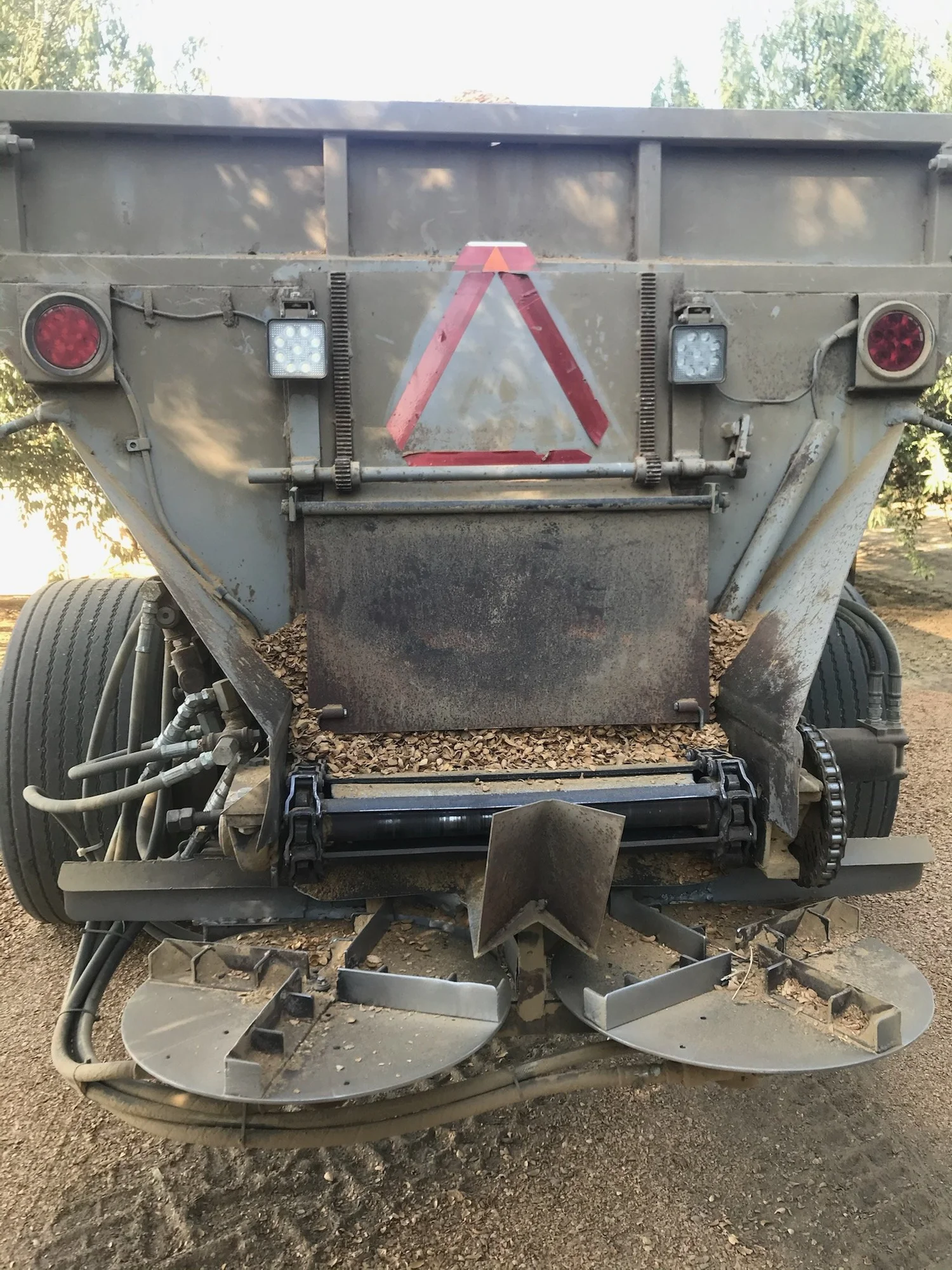 The benefits of applying almond hulls and shells as mulch in orchards