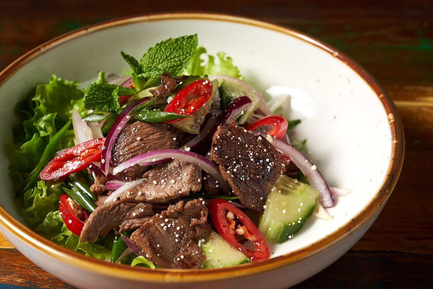 Tonight&rsquo;s dinner is a celebration of flavors! Spicy Grilled Beef Salad with red onions, scallions, mint leaves and roasted rice in spicy lime dressing. Each bite is a symphony of sweet, spicy, and savory notes, Who said healthy eating couldn&rs