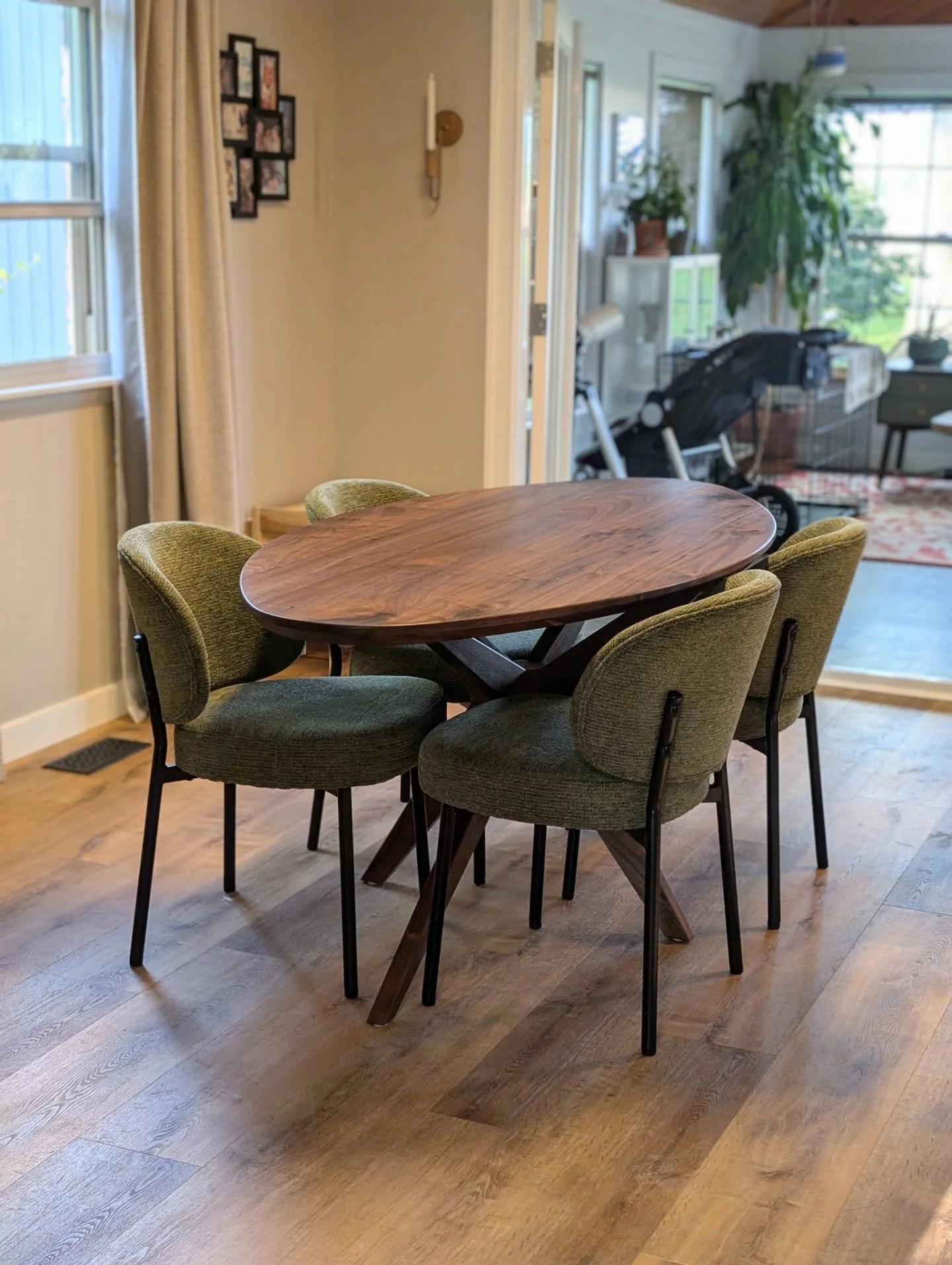 This mid century modern dining table was such a fulfilling project to see come together in the space. 

The top was shaped into a surfboard ellipse with a heavy chamfer on the bottom side. The Starburst leg design has two different splays- responding