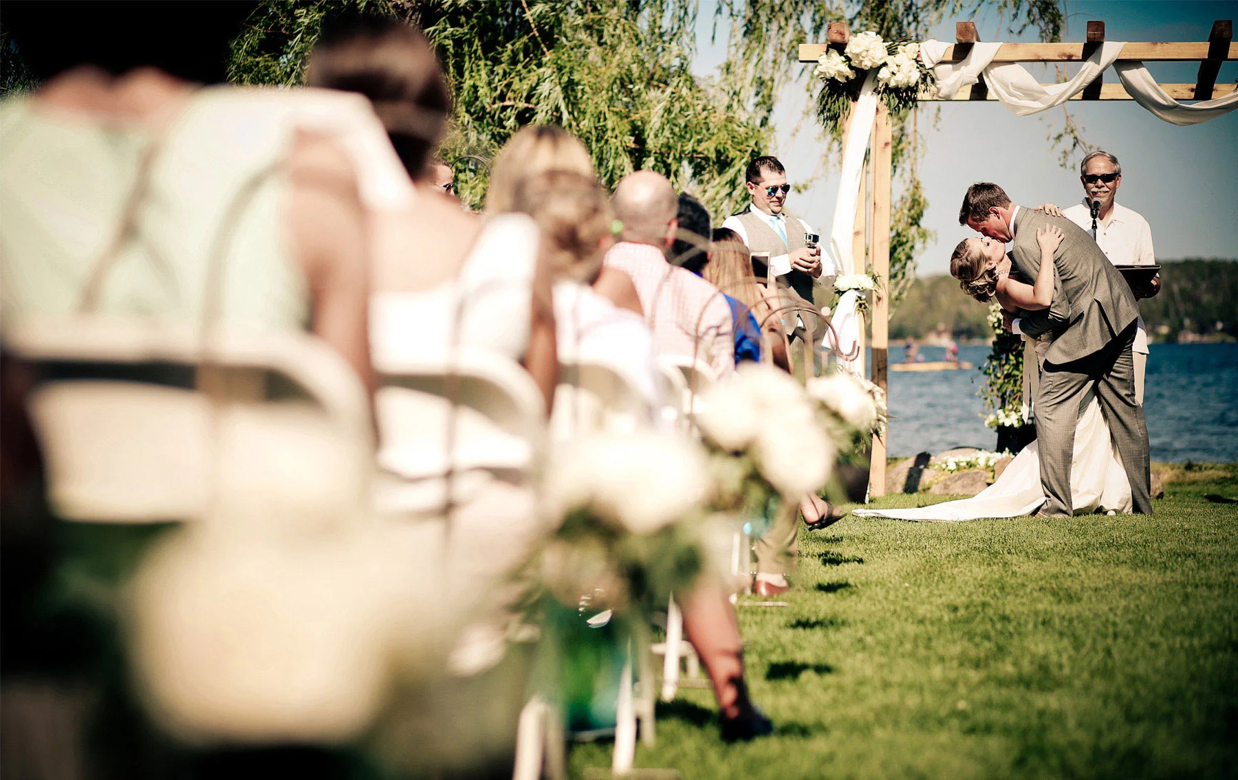 12-Brainerd-Minnesota-Wedding-Photography-by-Vick-Photography-Craguns-Resort-Outdoor-Lake-Ceremony-First-Kiss-Lucy-&-Matt.jpg