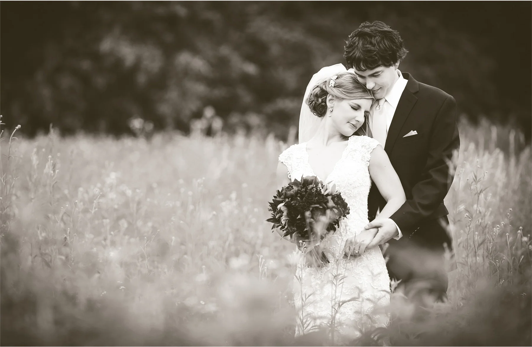 13-Minneapolis-Minnesota-Wedding-Photographer-by-Andrew-Vick-Photography-Summer-Semple-Mansion-Bride-Groom-Embrace-Field-Sepia-Stephanie-and-Brady.jpg