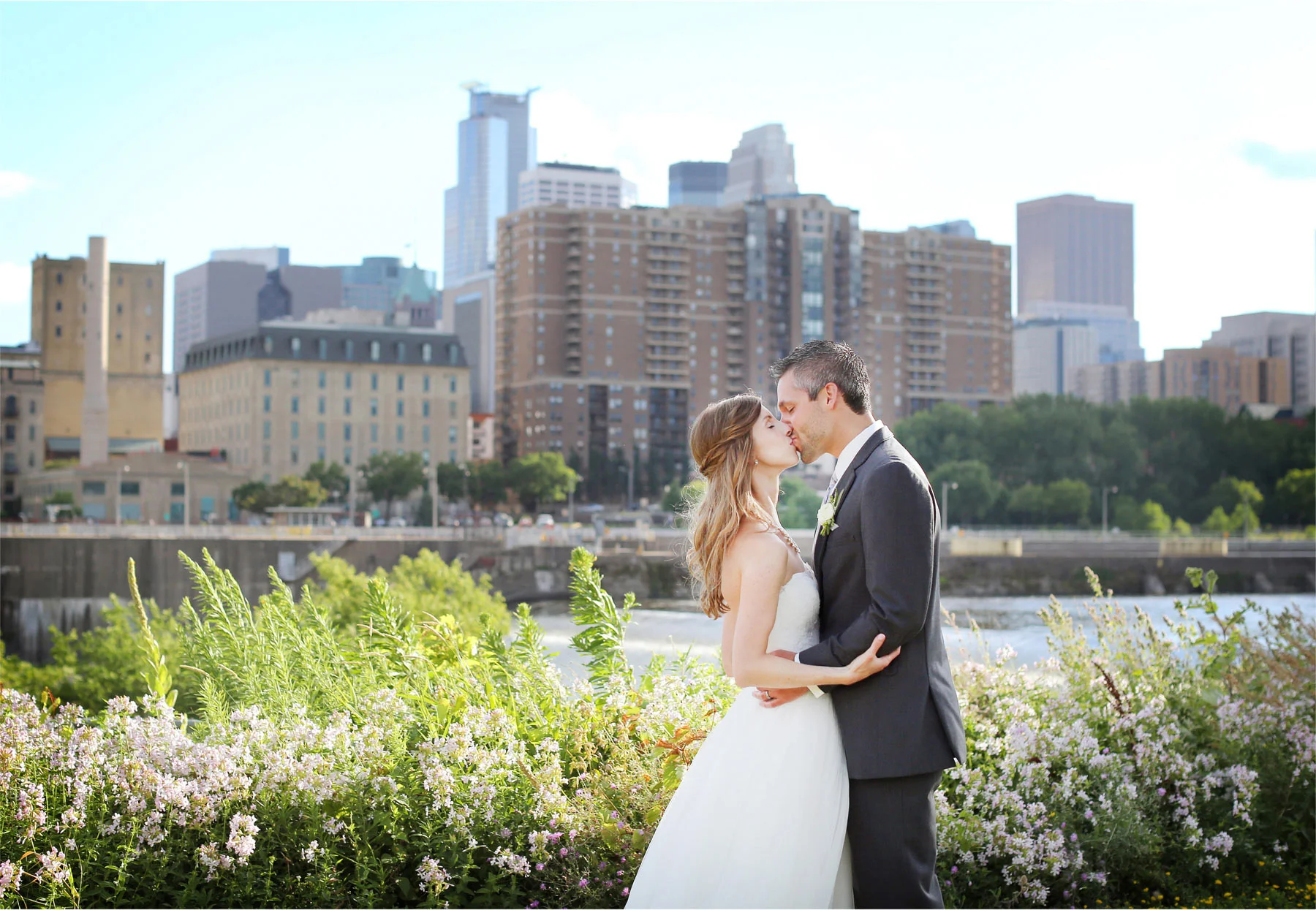 16-Minneapolis-Minnesota-Wedding-Photographer-by-Andrew-Vick-Photography-Summer-Bride-Groom-Kiss-Downtown-Mississippi-River-Katie-and-Travis.jpg