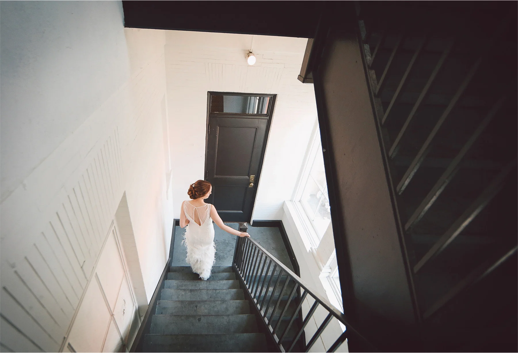 03-Minneapolis-Minnesota-Wedding-Photographer-by-Andrew-Vick-Photography-Summer-Semple-Mansion-Bride-Dress-Feathers-Stairwell-Stairs-First-Meeting-Look-Vintage-Stephanie-and-Robert.jpg