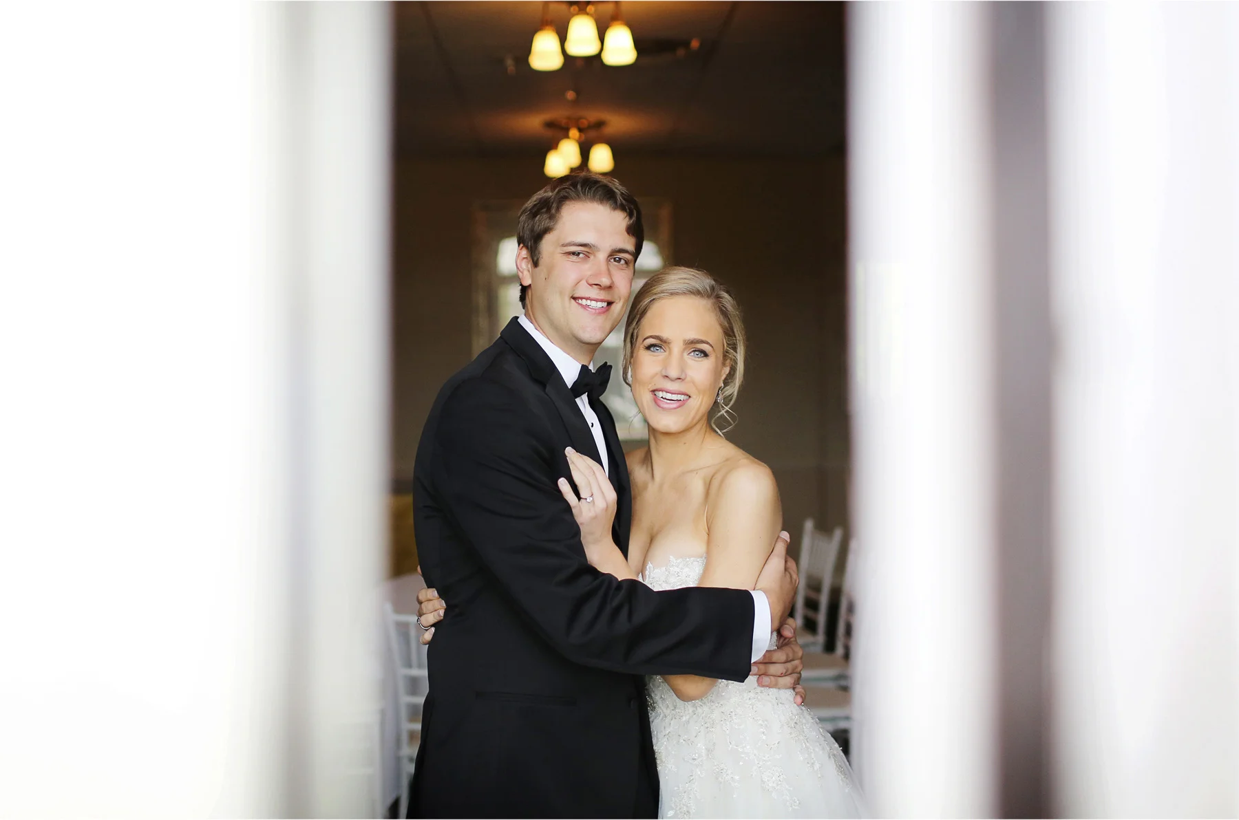 05-Minneapolis-Minnesota-Wedding-Photographer-by-Andrew-Vick-Photography-Summer-Calhoun-Beach-Club-First-Meeting-Look-Bride-Groom-Embrace-Michelle-and-Kevin.jpg