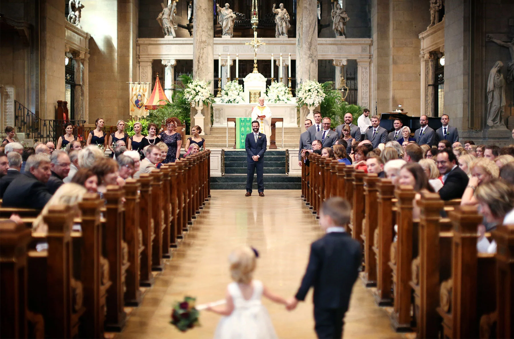 12-Minneapolis-Minnesota-Wedding-Photographer-by-Andrew-Vick-Photography-Summer-Basilica-of-Saint-Mary-Church-Ceremony-Groom-Flower-Girl-Ring-Bearer-Aisle-Ashley-and-Eric.jpg