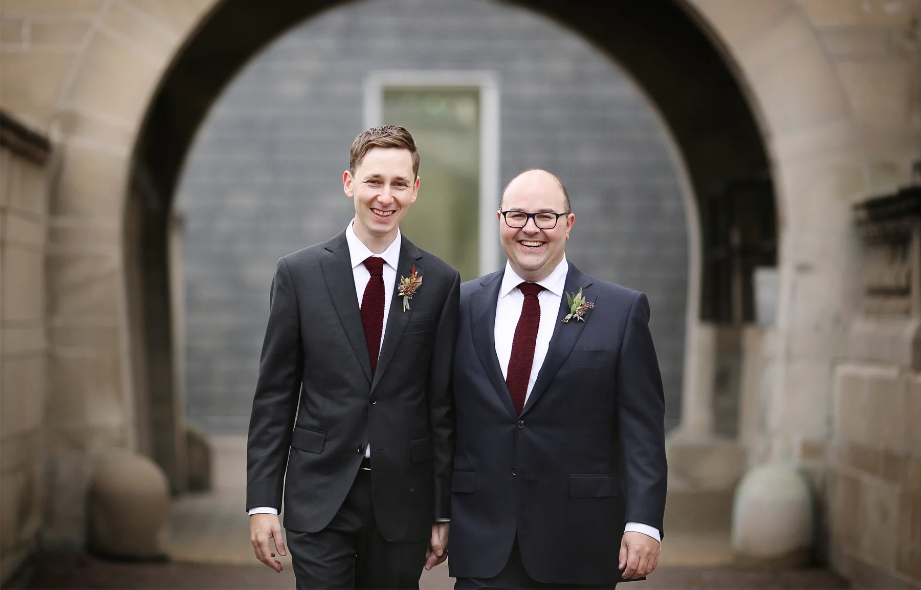 08-Minneapolis-Minnesota-Wedding-Photographer-by-Andrew-Vick-Photography-Fall-Autumn-American-Swedish-Institute-First-Meeting-Look-Groom-Holding-Hands-Ben-and-Adam.jpg