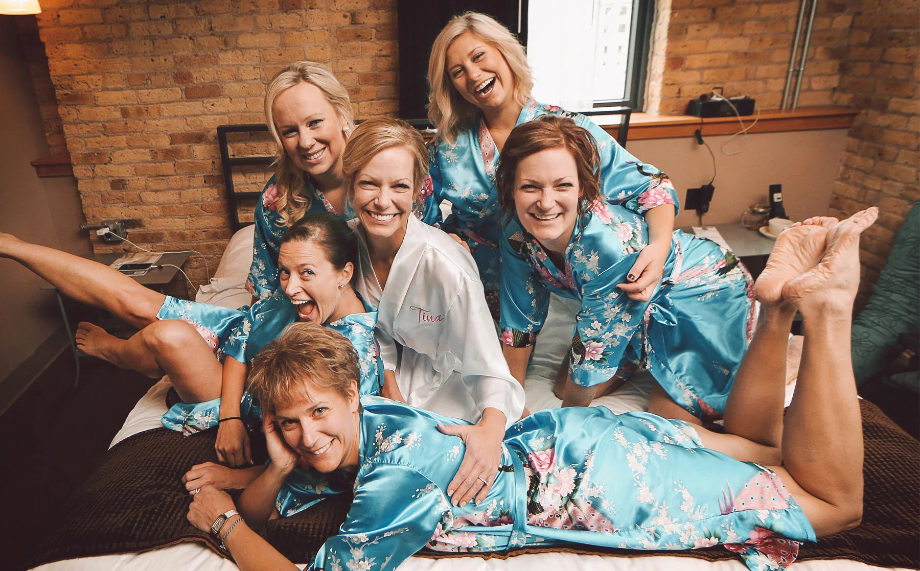 03-Milwaukee-Wisconsin-Wedding-Photographer-by-Andrew-Vick-Photography-Fall-Autumn-Destination-Iron-Horse-Hotel-Getting-Ready-Bride-Bridesmaids-Robes-Vintage-Tina-and-Kevin.jpg