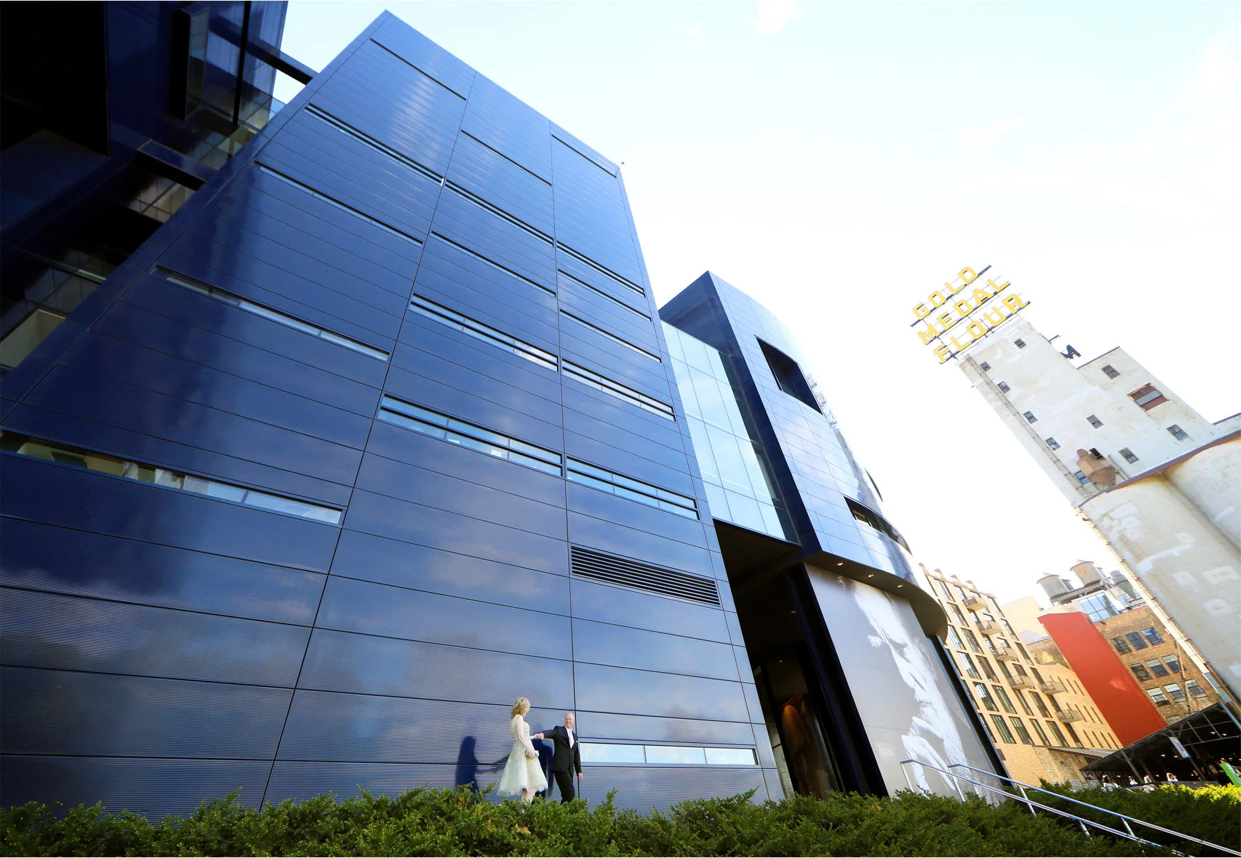 09-Minneapolis-Minnesota-Wedding-Photographer-by-Andrew-Vick-Photography-Spring-Guthrie-Theater-Downtown-Bride-Groom-Gold-Metal-Sign-Dannette-and-Darren.jpg