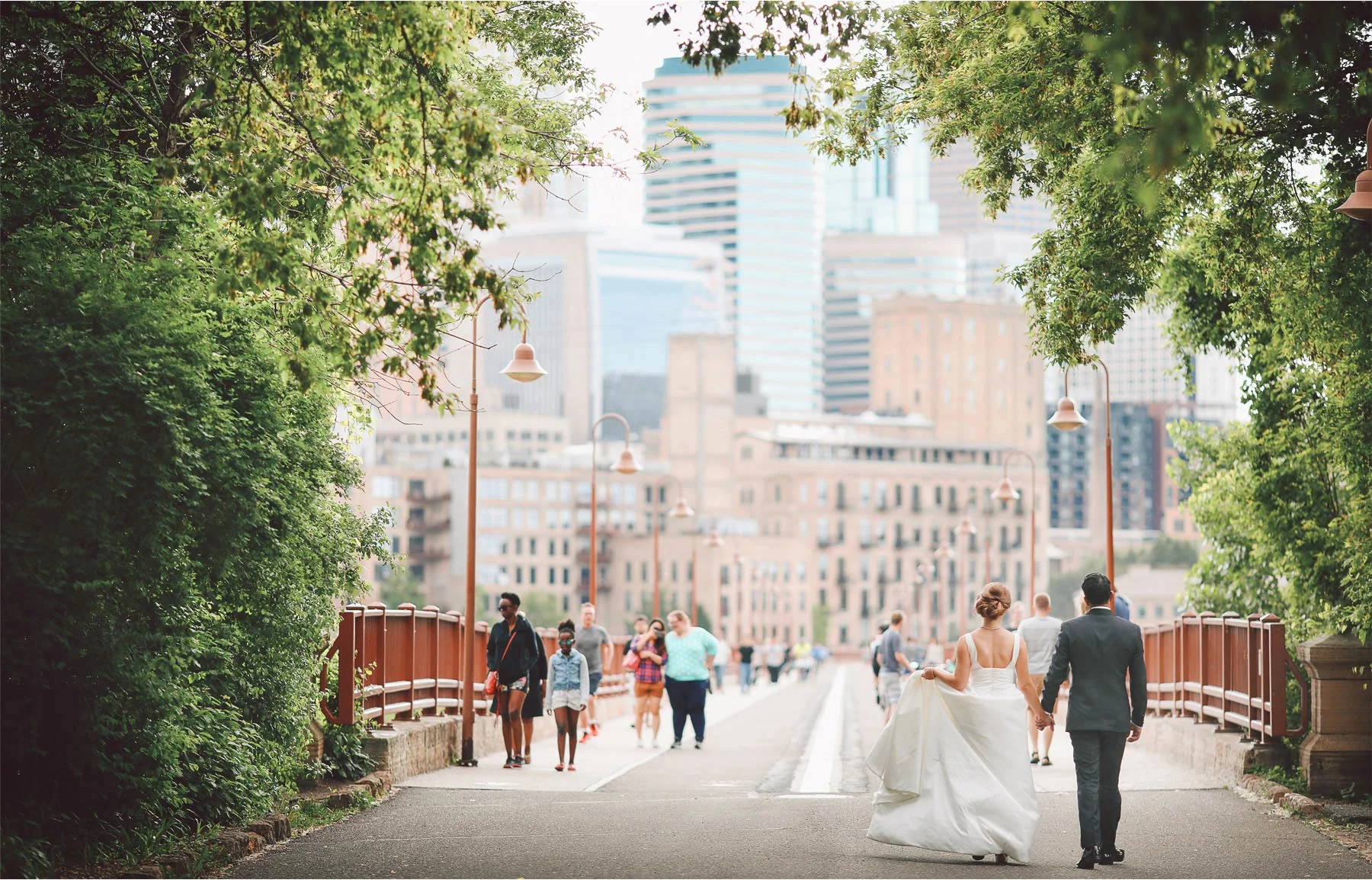 17-Minneapolis-Minnesota-Wedding-Photographer-by-Andrew-Vick-Photography--Spring-Stone-Arch-Bridge-Bride-Groom-Pedestrians-Downtown-Skyline-Vintage-Rachel-and-Venu.jpg