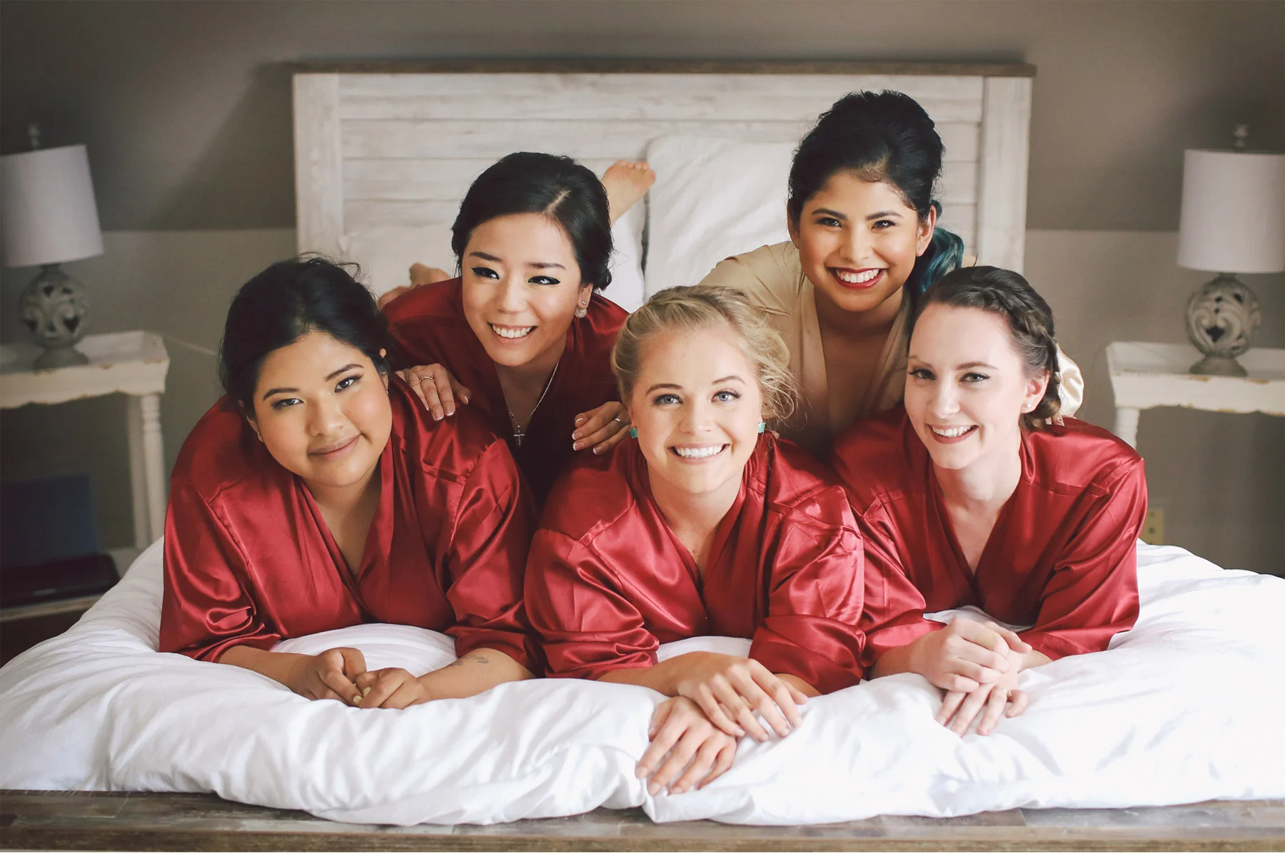 01-Saint-Paul-Minnesota-Wedding-Photography-by-Vick-Photography-Bridesmaid-Custom-Red-Robes-Getting-Ready-Hotel-Elena-and-Doug.jpg