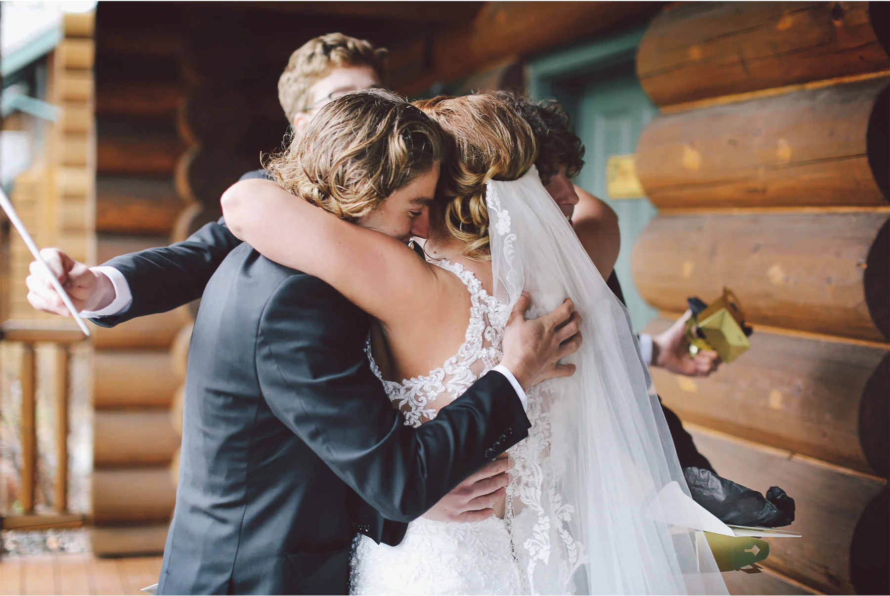 04-Minnesota-Wedding-by-Andrew-Vick-Photography-Grand-Superior-Lodge-Duluth-Two-Harbors-Bride-Brothers-Hug-Veronica-and-Tyler.jpg