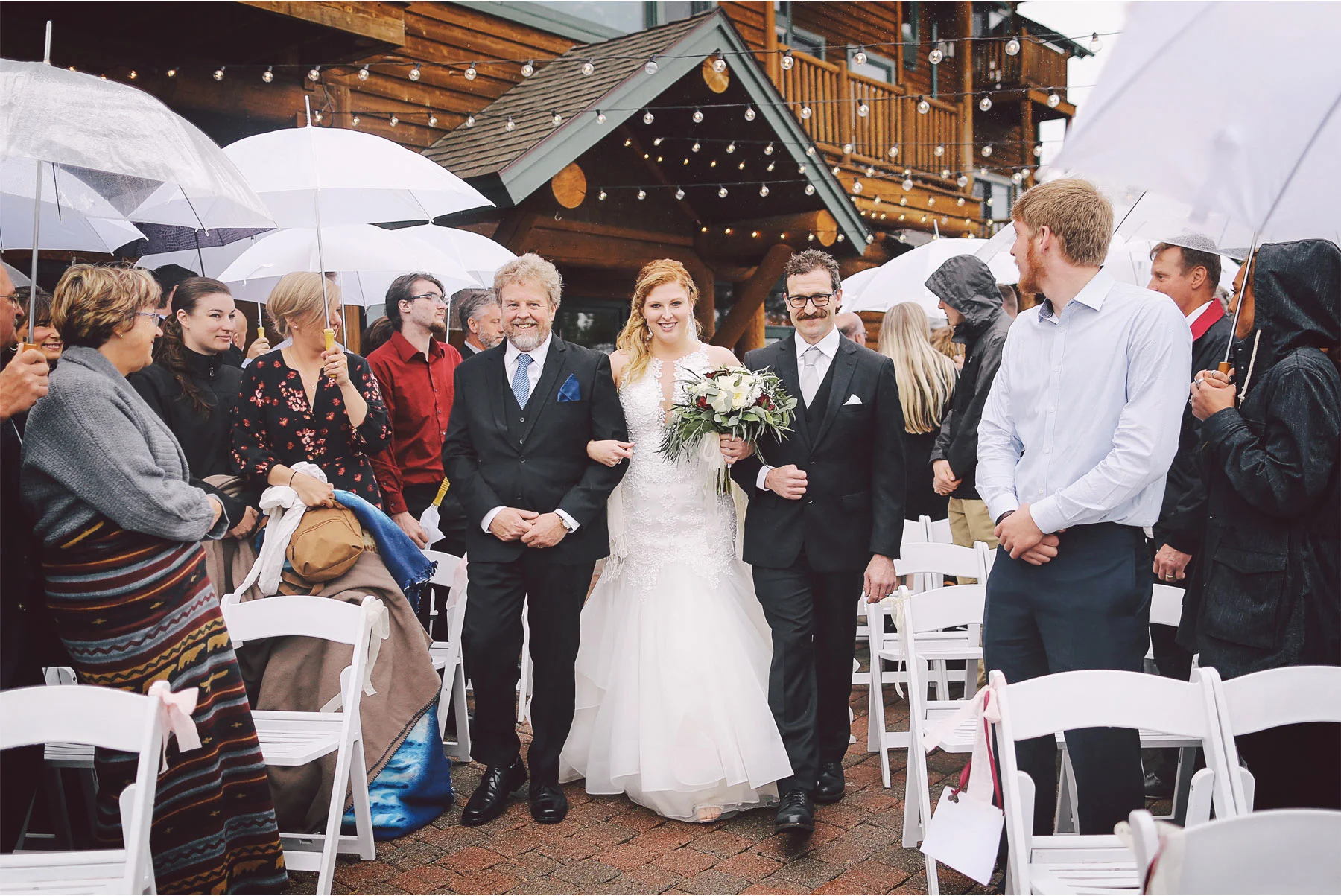14-Minnesota-Wedding-by-Andrew-Vick-Photography-Grand-Superior-Lodge-Duluth-Two-Harbors-Outdoor-Ceremony-Rain-Umbrellas-Aisle-Bride-Fathers-Veronica-and-Tyler.jpg