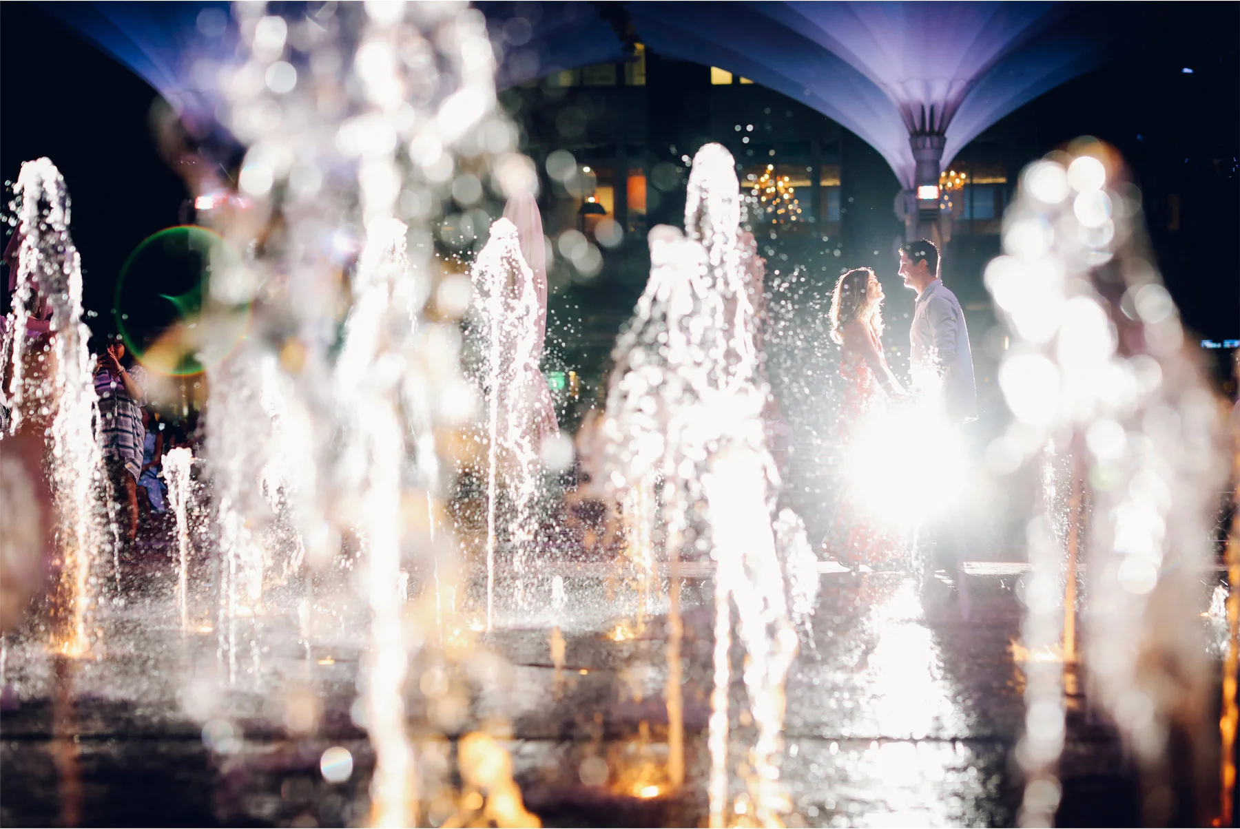17-Fly-to-Me-Destination-Engagement-Session-Vick-Photography-Fort-Worth-Texas-Couple-Night-Skyline-City-Lights-Downtown-Fountain-Maggie-and-Matt.jpg