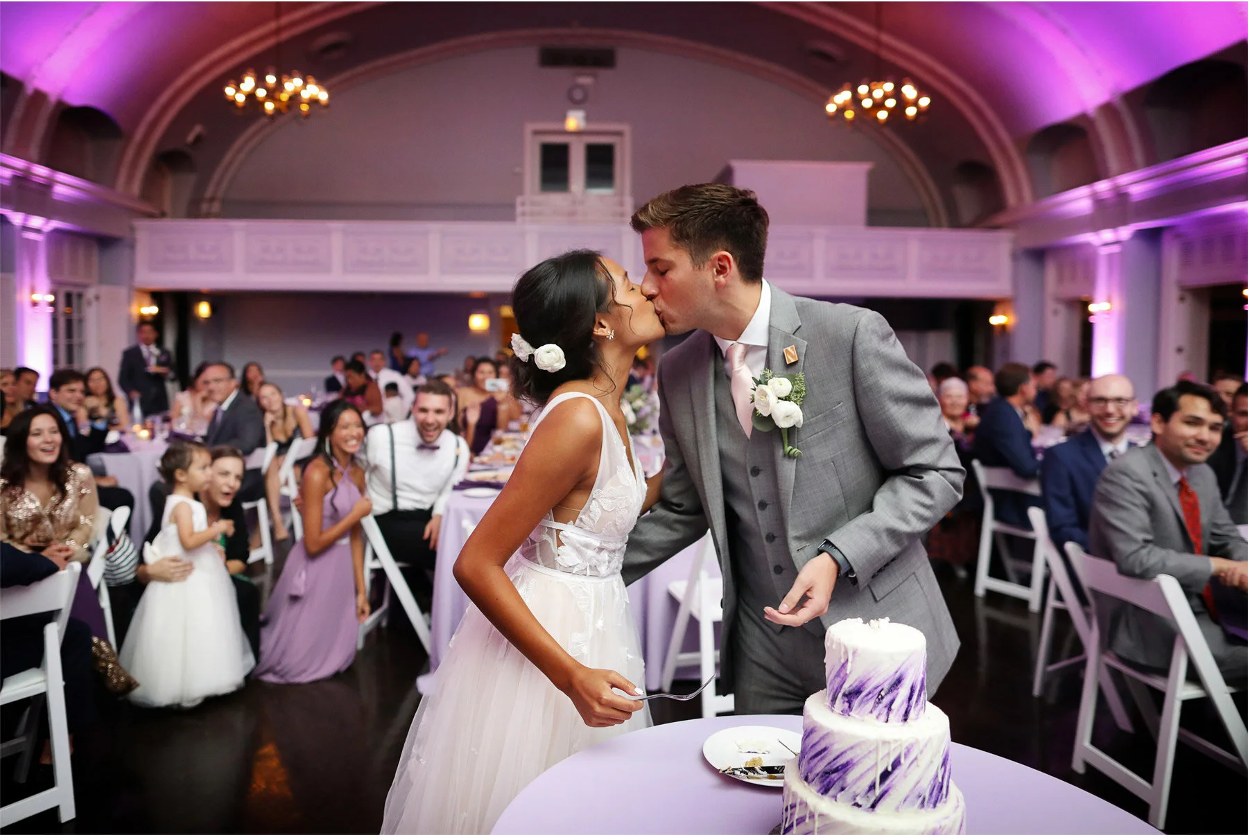 24-Wedding-by-Andrew-Vick-Photography-Chicago-Illinois-Reception-Womans-Club-of-Evanston-Cake-Kiss-Ashley-and-Nicholas.jpg