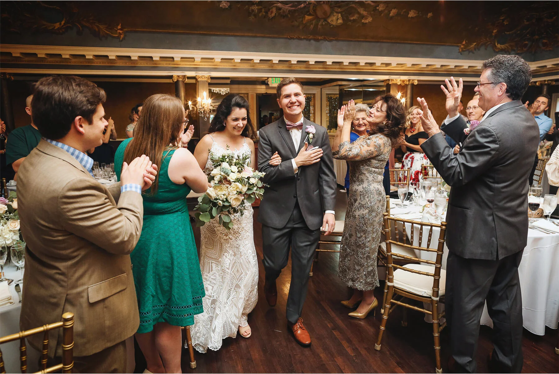 11-Wedding-by-Vick-Photography-Minneapolis-Minnesota-Semple-Mansion-Historic-Venue-Reception-Bride-Groom-Cheering-Kaitlyn-and-Nate.jpg