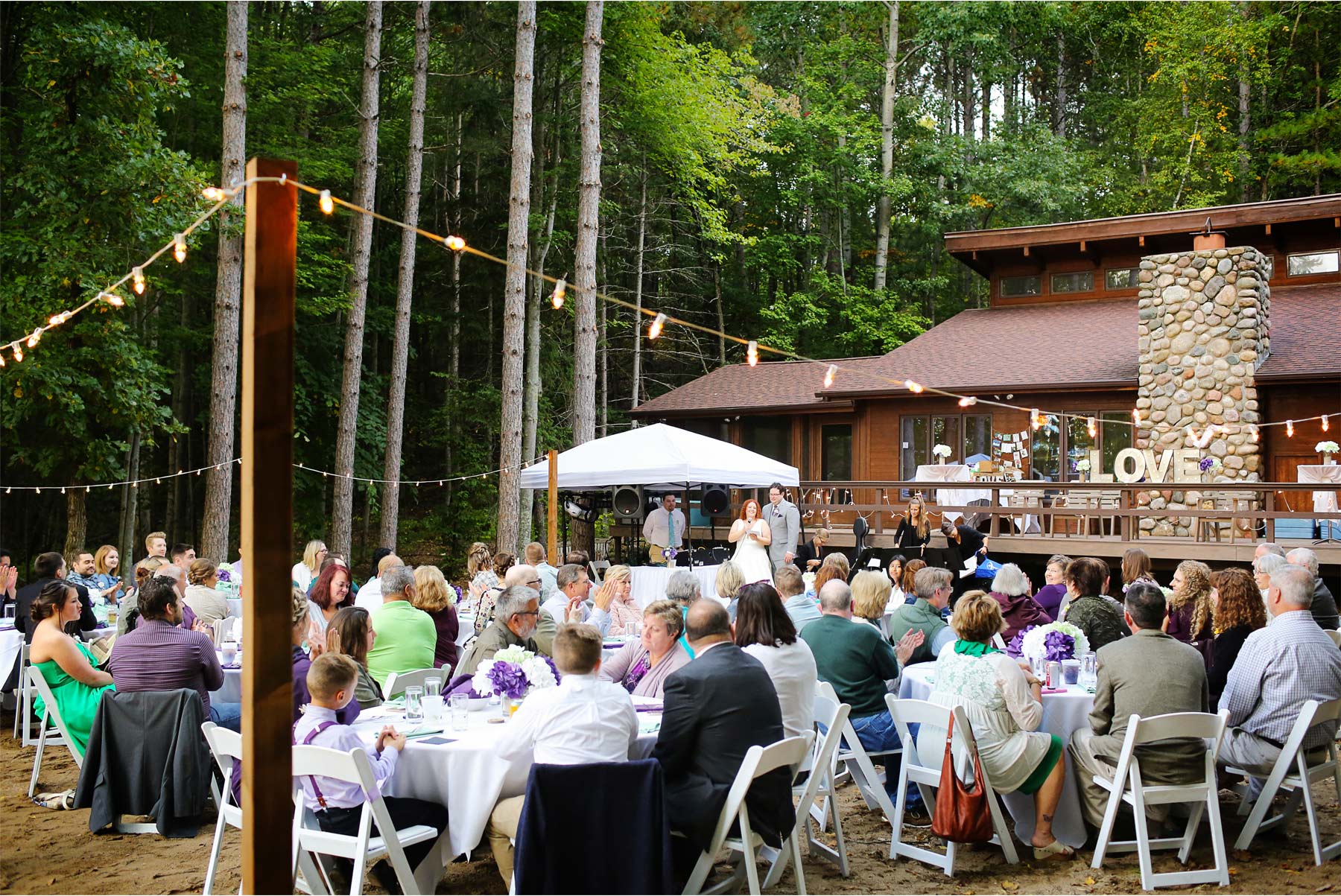 16-Vick-Photography-Wedding-Brainerd-Minnesota-Cabin-Woods-Rustic-Outdoor-Reception-Toasts-Kaycee-and-Mitchell.jpg