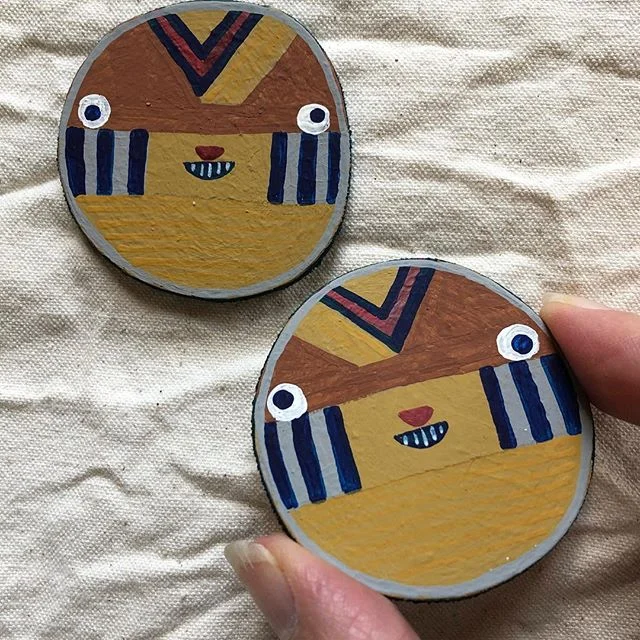 Before I went on holidays, I tried to make myself some earrings. They didn’t work out and I completely forgot about them. Until now. They’re mildly funny: like little footy jumpers with faces.  But it might have felt wrong to wear them in