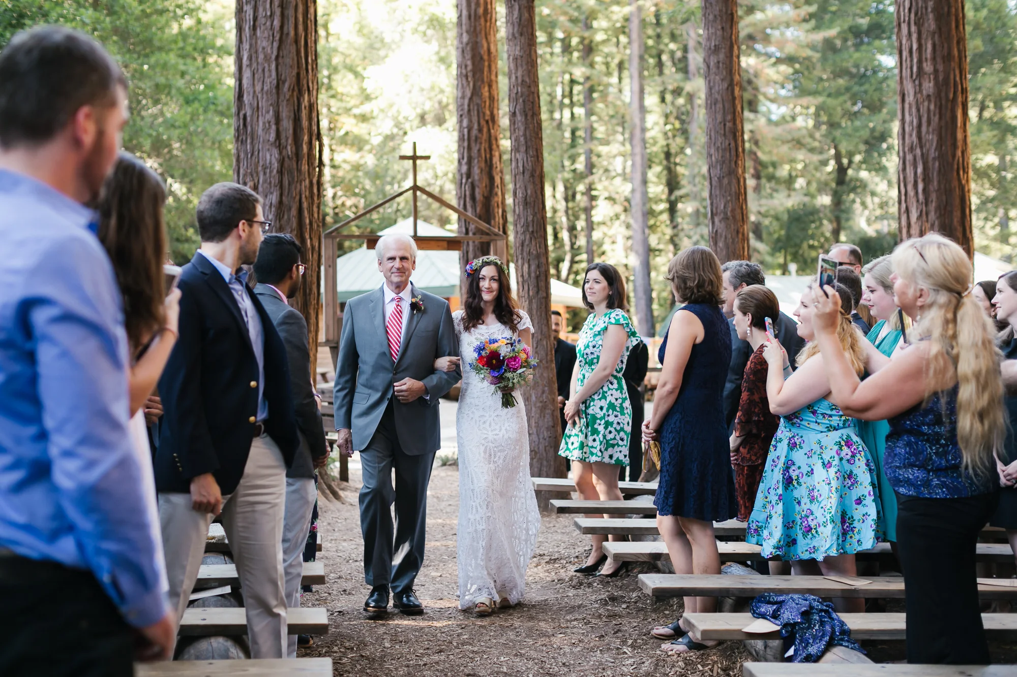 Bride and her father walk down the aisle