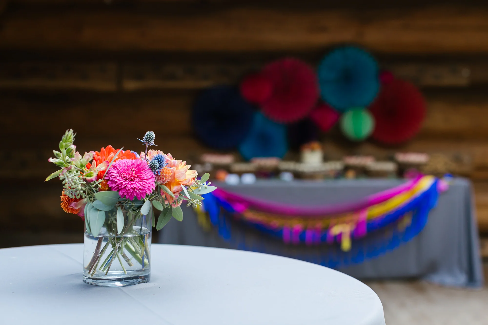 Colorful flowers decorate a cocktail table