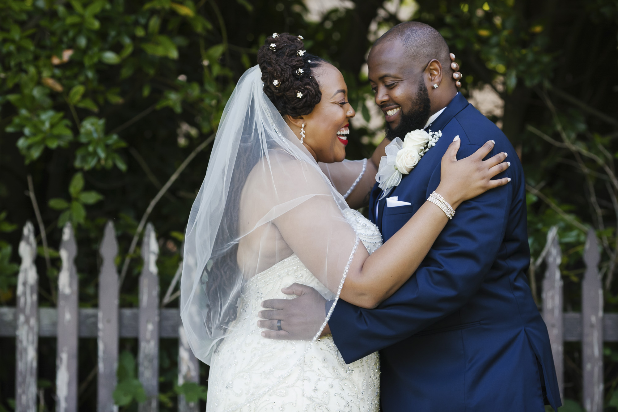A couple laugh together on their wedding day
