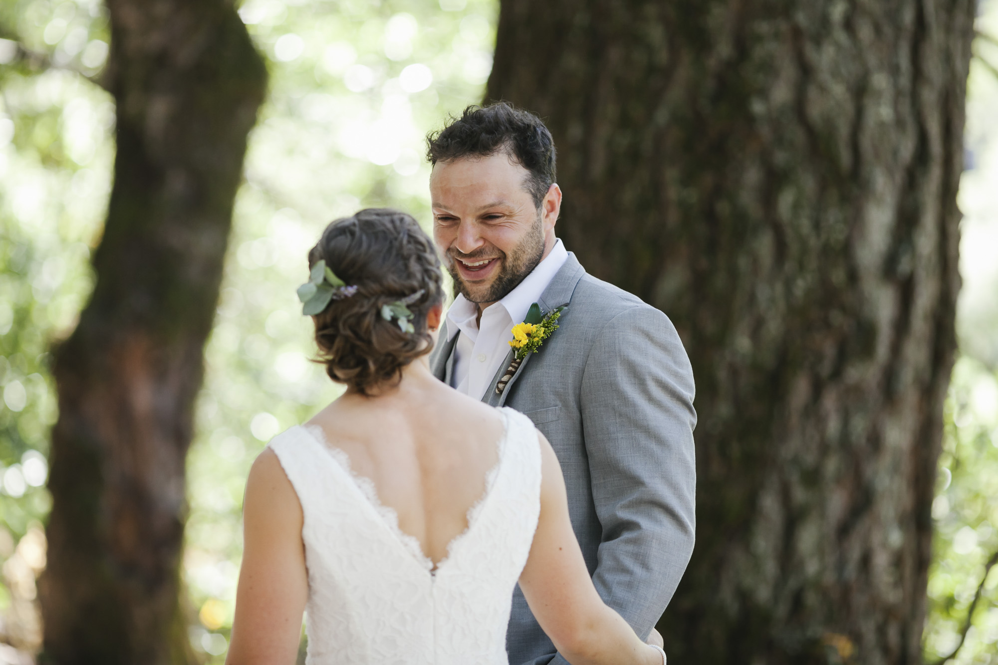 A groom sees his bride for the first time and is excited and happy