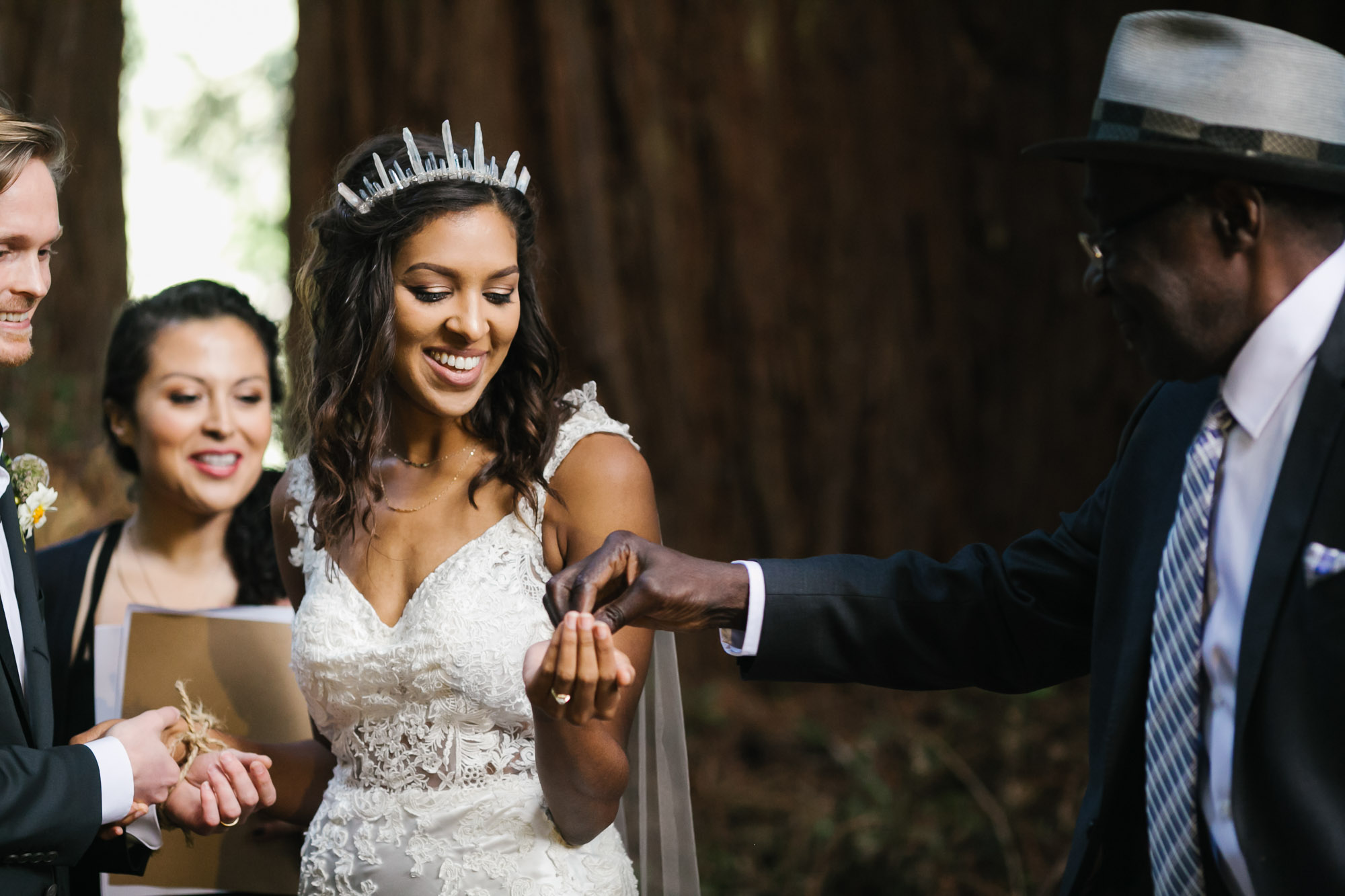 Bride accepts coins from her father during wedding ceremony