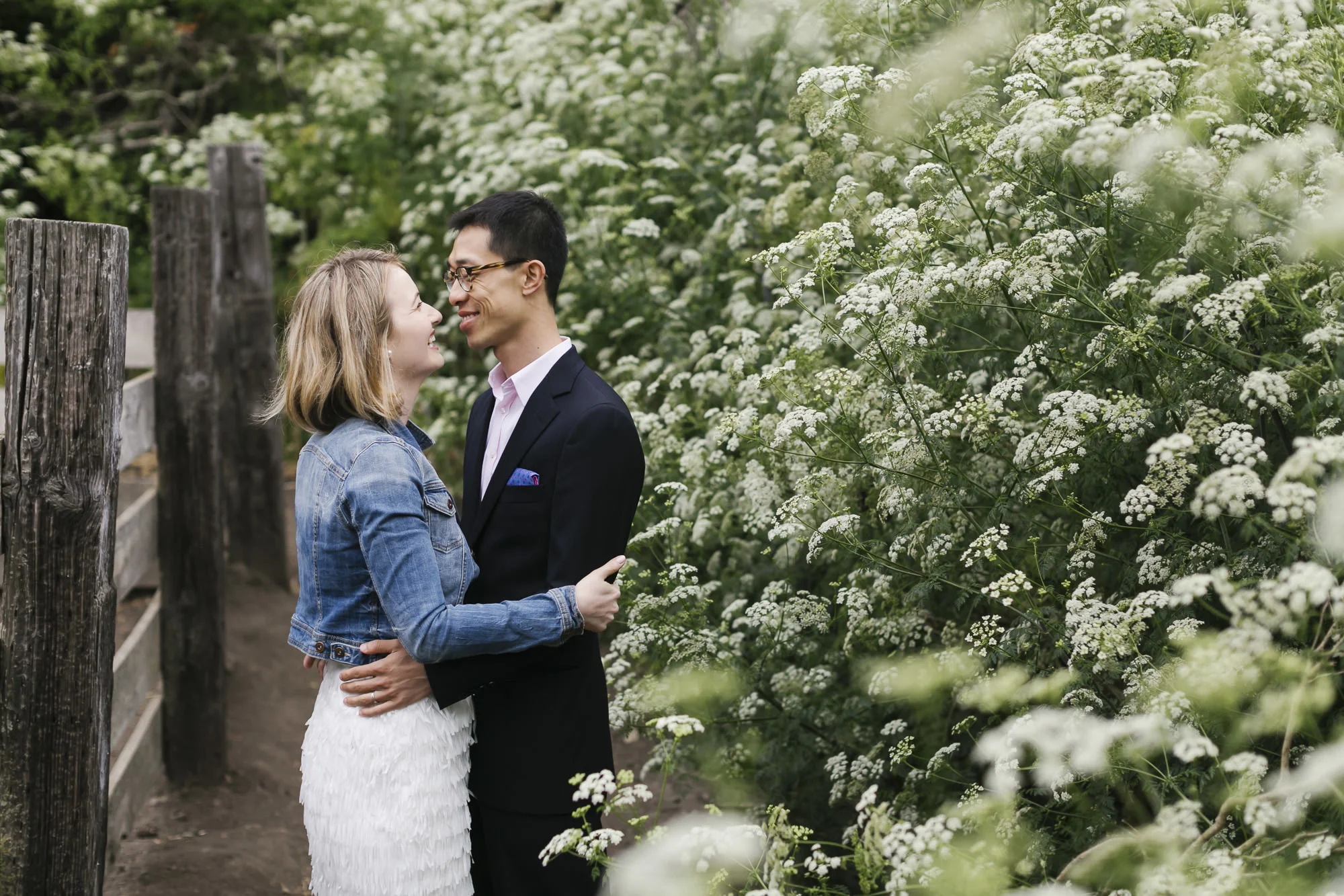 Engagement session at Slide Ranch next to baby goats and wildflowers
