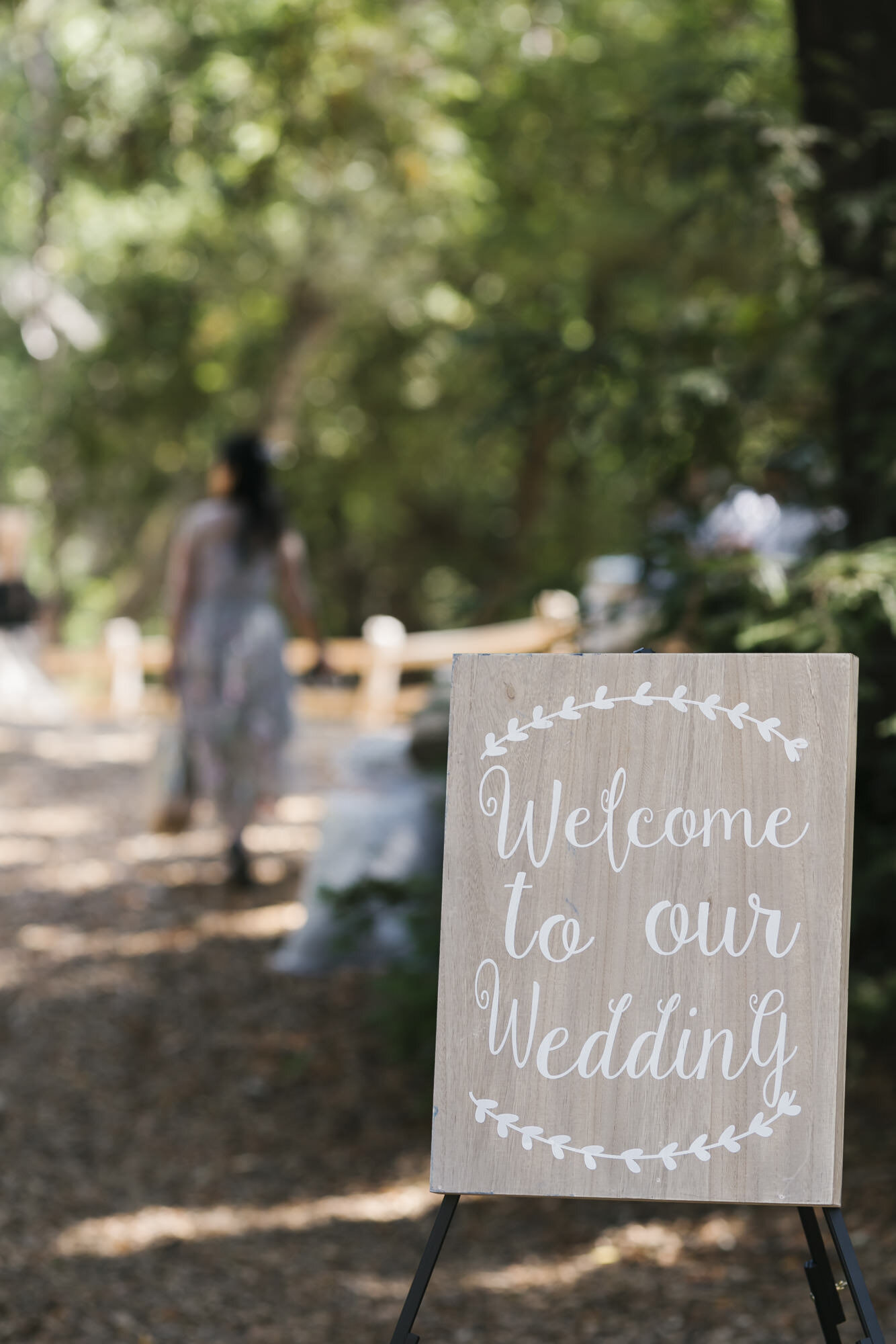 Welcome sign greets guests at picnic wedding