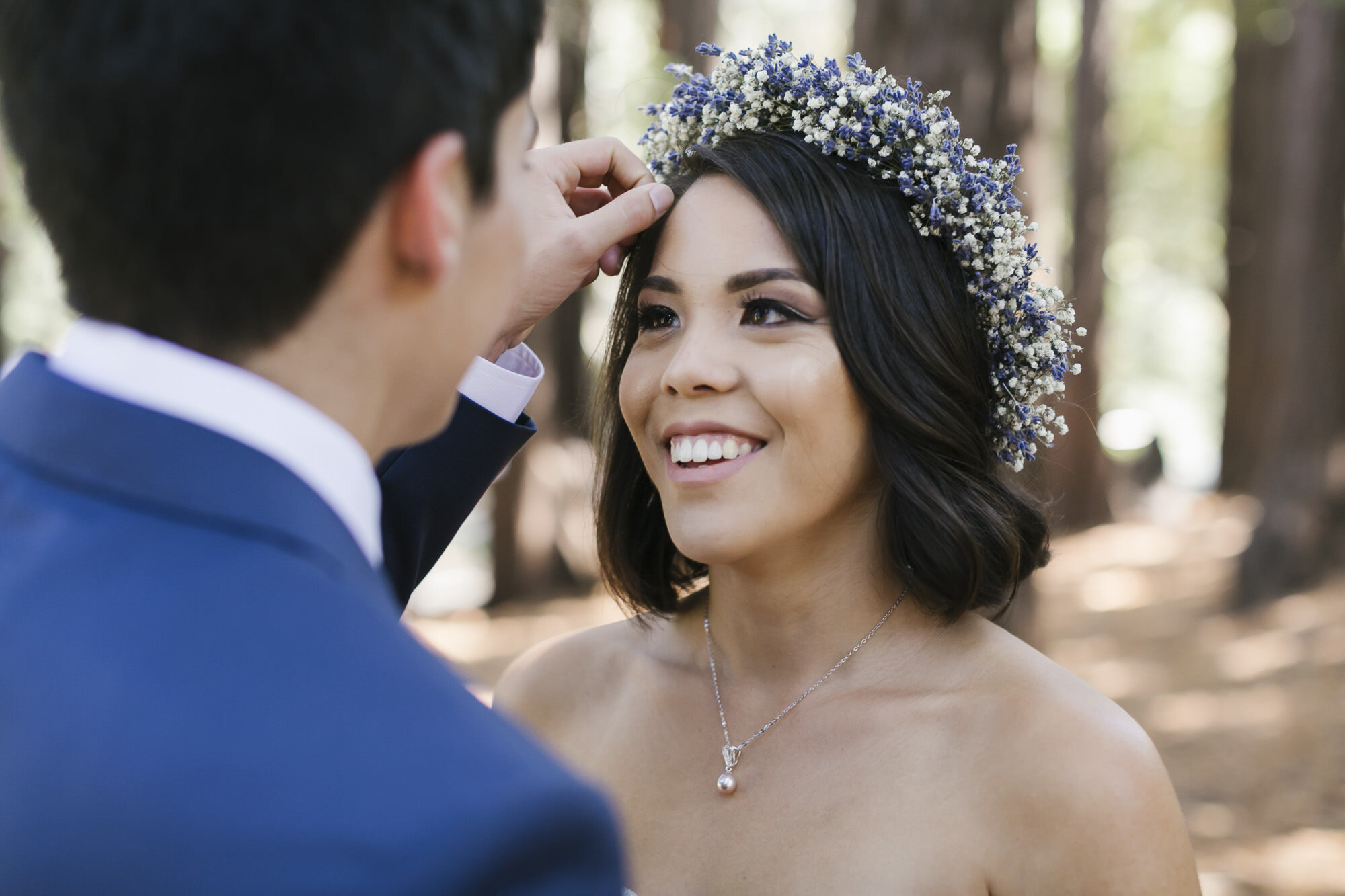 Groom fixes bride's hair 