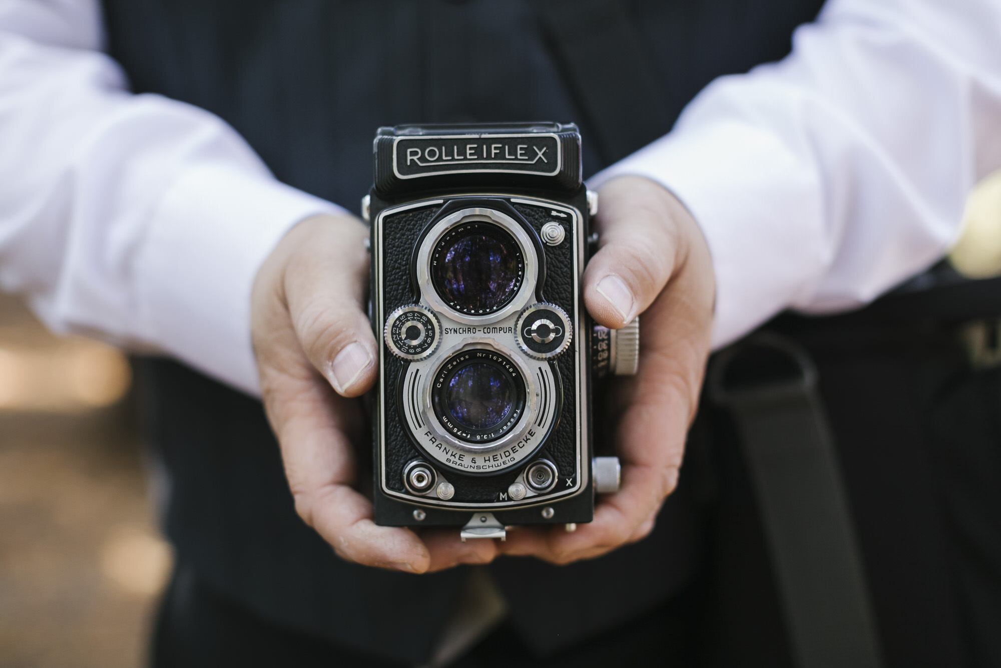 Guest holds Rolleiflex camera