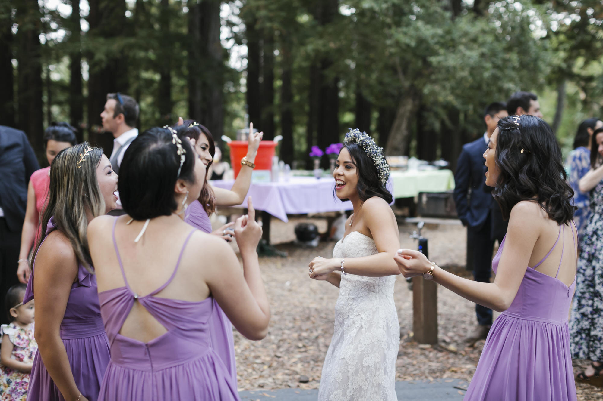 Bride enjoys dancing outdoors in a redwood forest