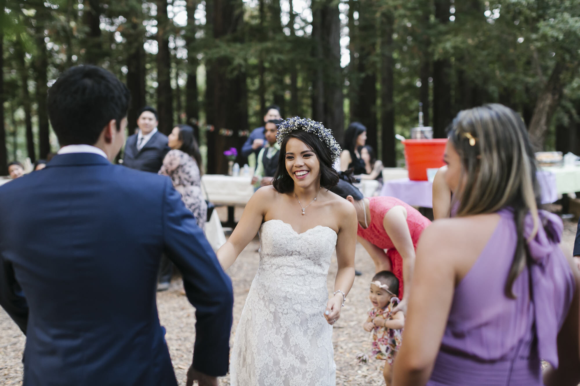 Bride enjoys dancing outdoors in a redwood forest