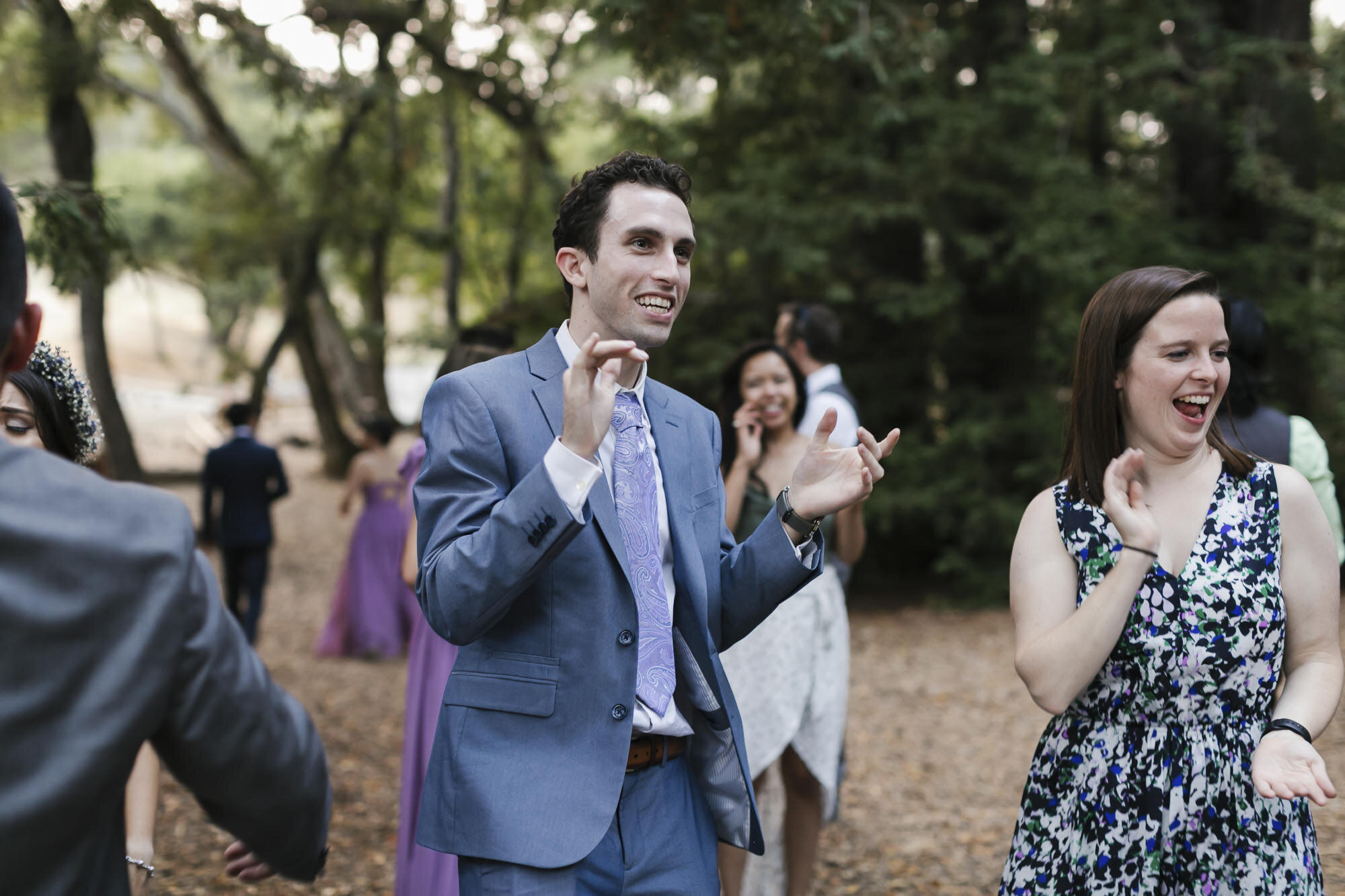 Guests enjoy dancing outdoors in a redwood forest