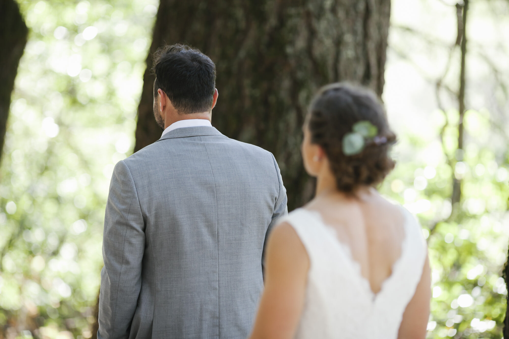 Crossfit wedding couple have their first look in the woods