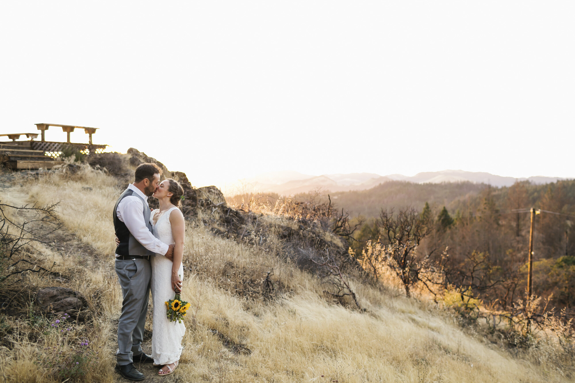 Sunset wedding portraits among wildfire burn damage in Sonoma California