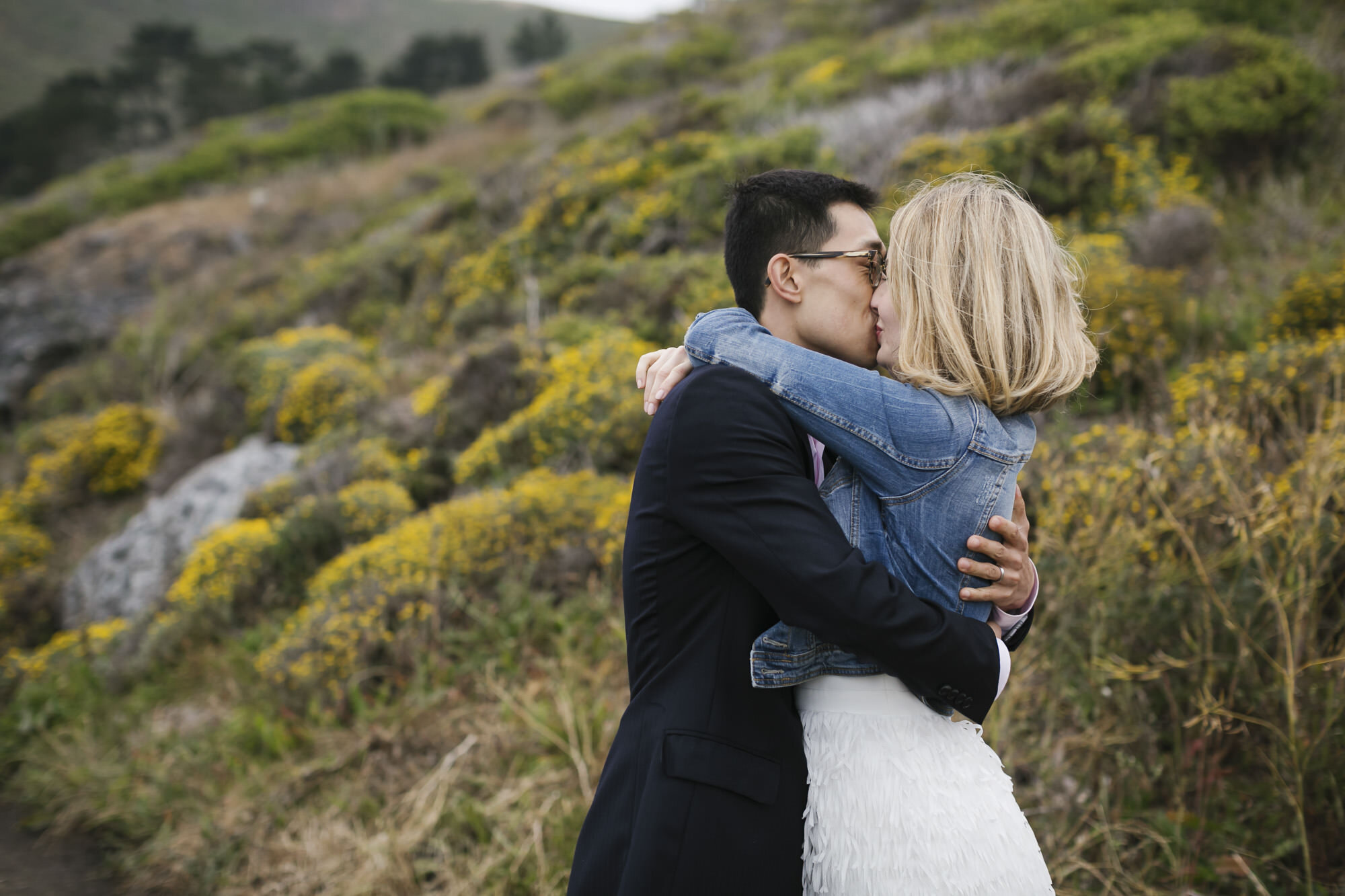 Couple kiss at Slide Ranch during their anniversary portrait session