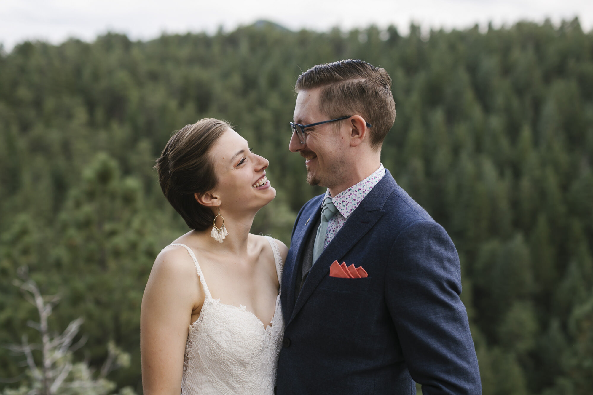Bride and groom laugh during their adventure elopement portraits