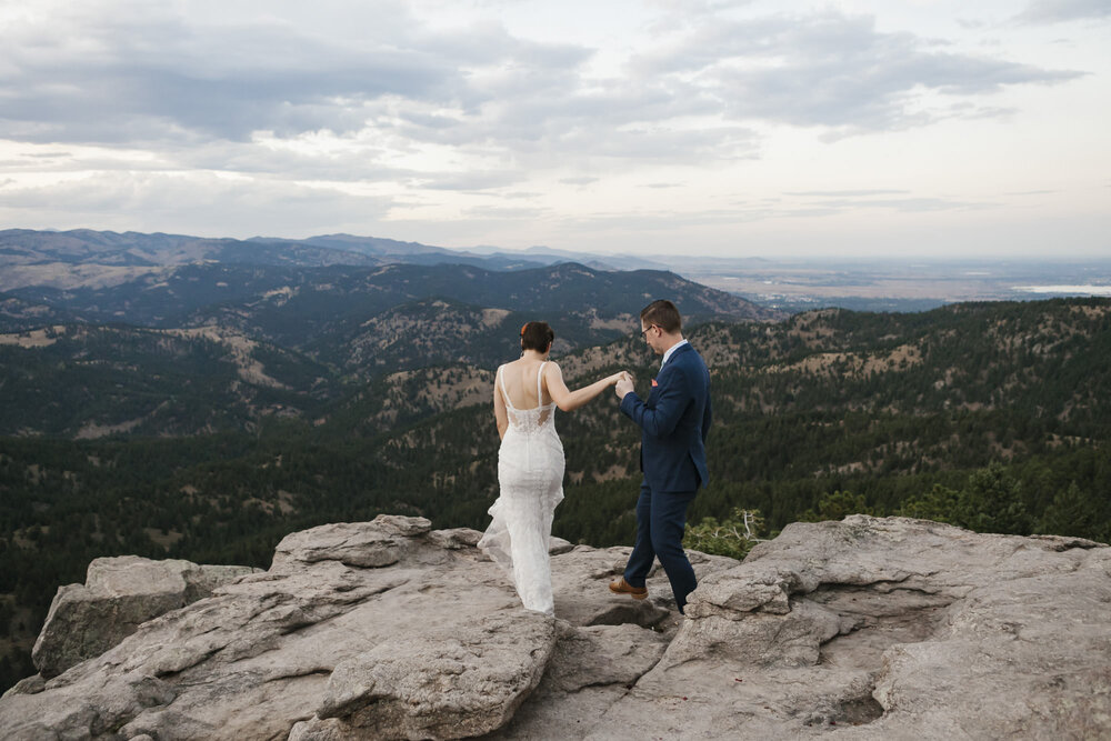 Adventure elopement couple hike together on their wedding day in Colorado