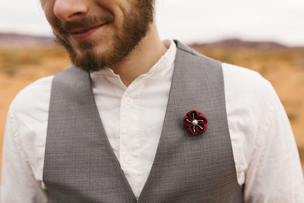 Detail shot of the groom's custom made boutonniere