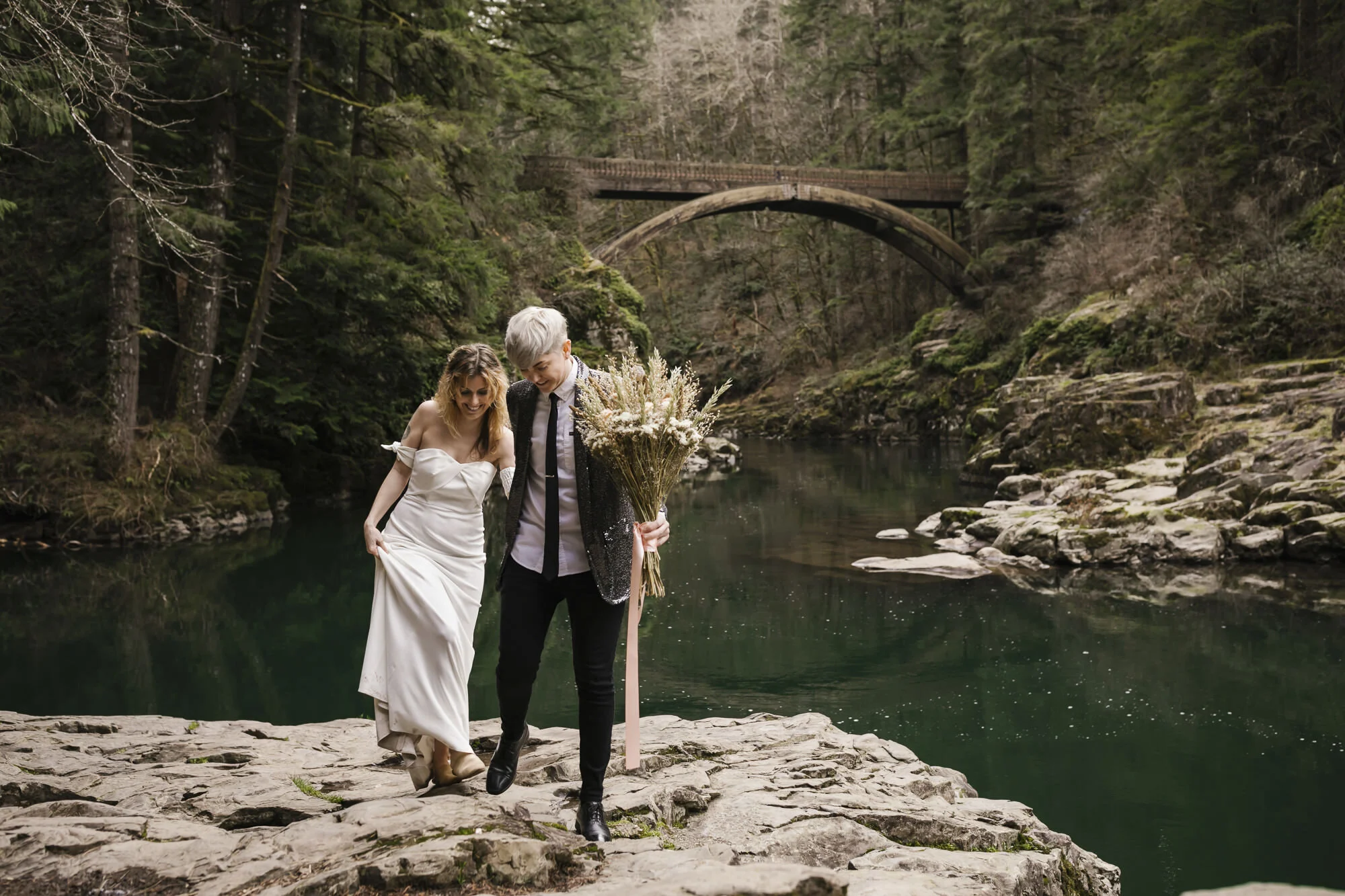 Same sex couple celebrate their wedding at Moulton Falls in Washington